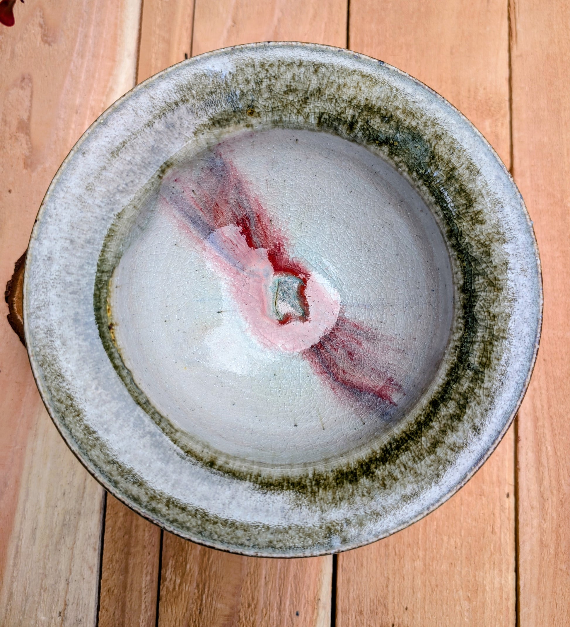 Handcrafted with timeless simplicity, this signed studio pottery serving bowl pairs a soft celadon-gray glaze with a warm iron-rich stoneware body. Its versatile size and understated design make it equally beautiful for serving, display, or everyday living.