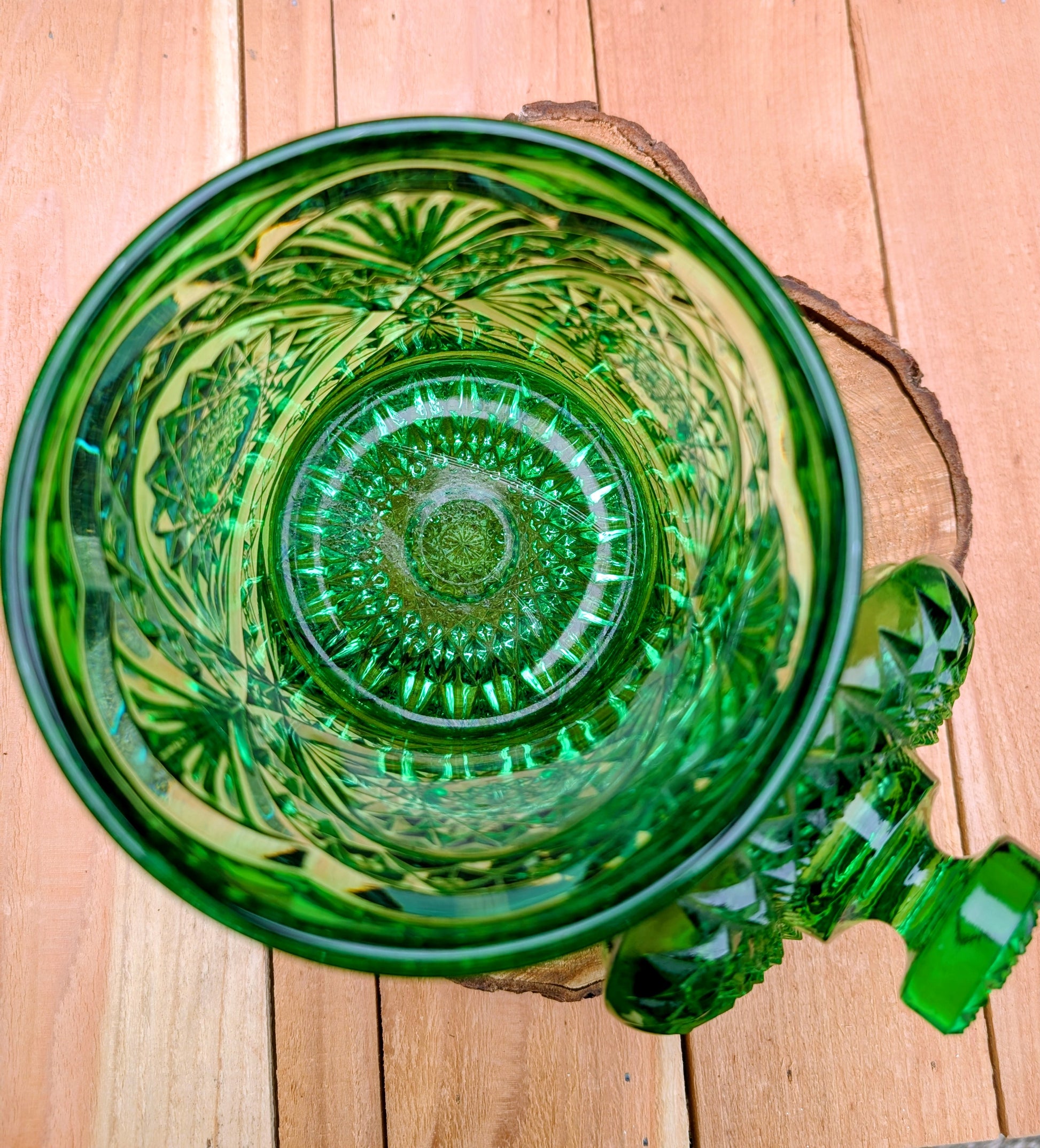 A brilliant Mid-Century collectible crafted in rich emerald pressed glass featuring Imperial's iconic Hobstar pattern.