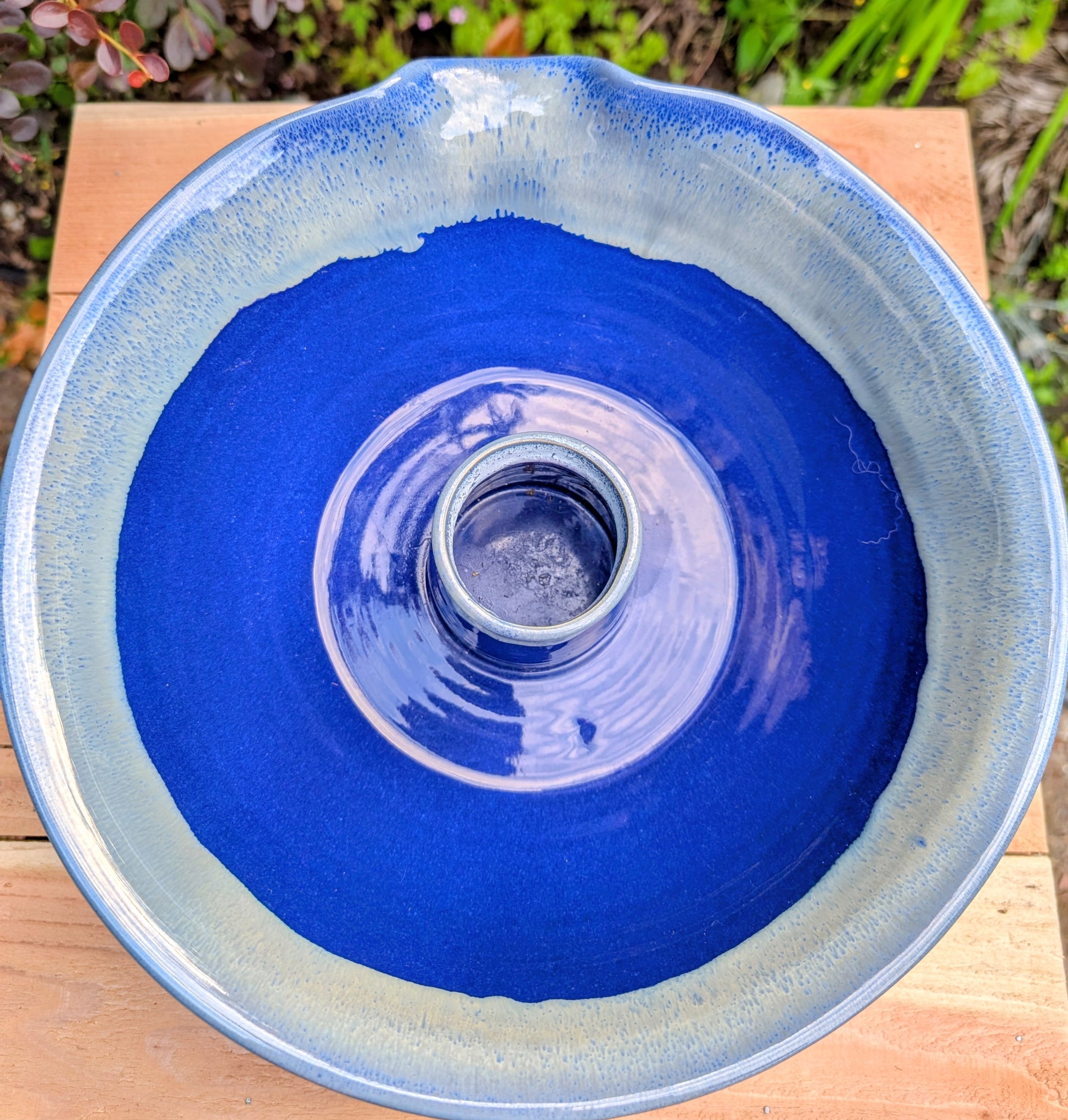 Bring handcrafted Southern stoneware into your kitchen with this vintage Tumbleweed Pottery Dixie Chicken Cooker. Designed to roast poultry upright for juicy, flavorful results, its vibrant cobalt blue glaze also makes it a beautiful serving and display piece when not in use.