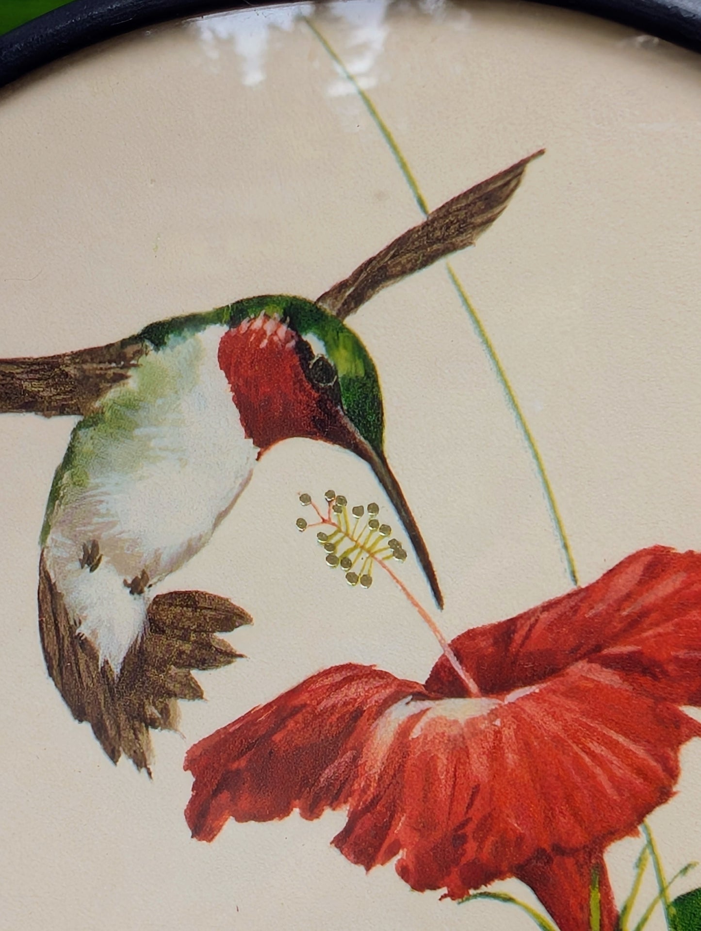 Bring the beauty of a hummingbird in bloom into your home with this handcrafted stained glass hanging panel. Featuring vibrant textured art glass surrounding a detailed hummingbird and hibiscus centerpiece, it catches natural light beautifully and adds year-round color to any window, sunroom, or garden-inspired space.