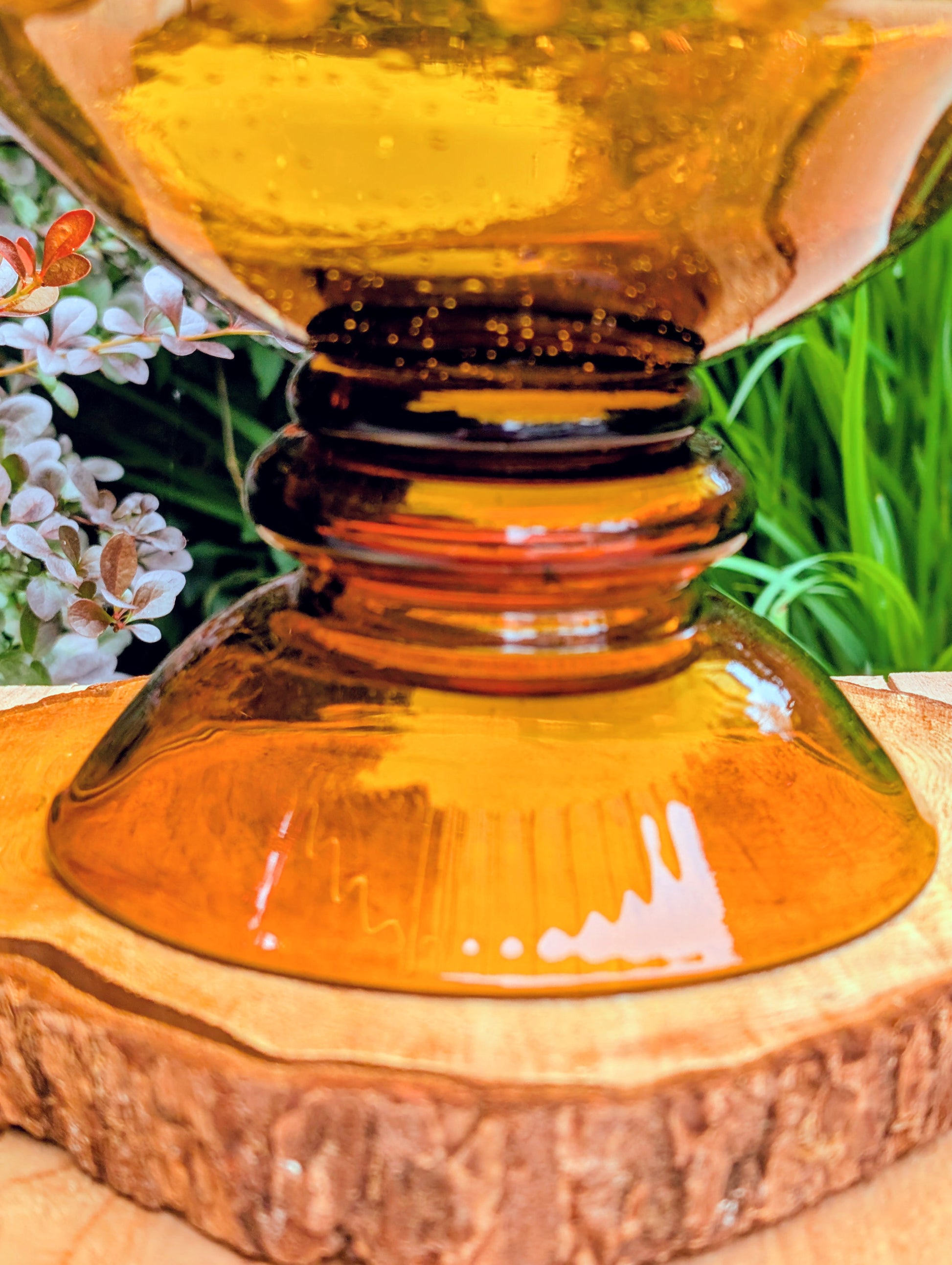 Bring warm vintage charm to your home with this large amber pressed glass pedestal console bowl, estimated to have been made by Indiana Glass during the 1960s–1970s. Its dramatic ruffled rim and generous size make it a beautiful centerpiece for seasonal displays, fruit, florals, or decorative accents throughout the year.