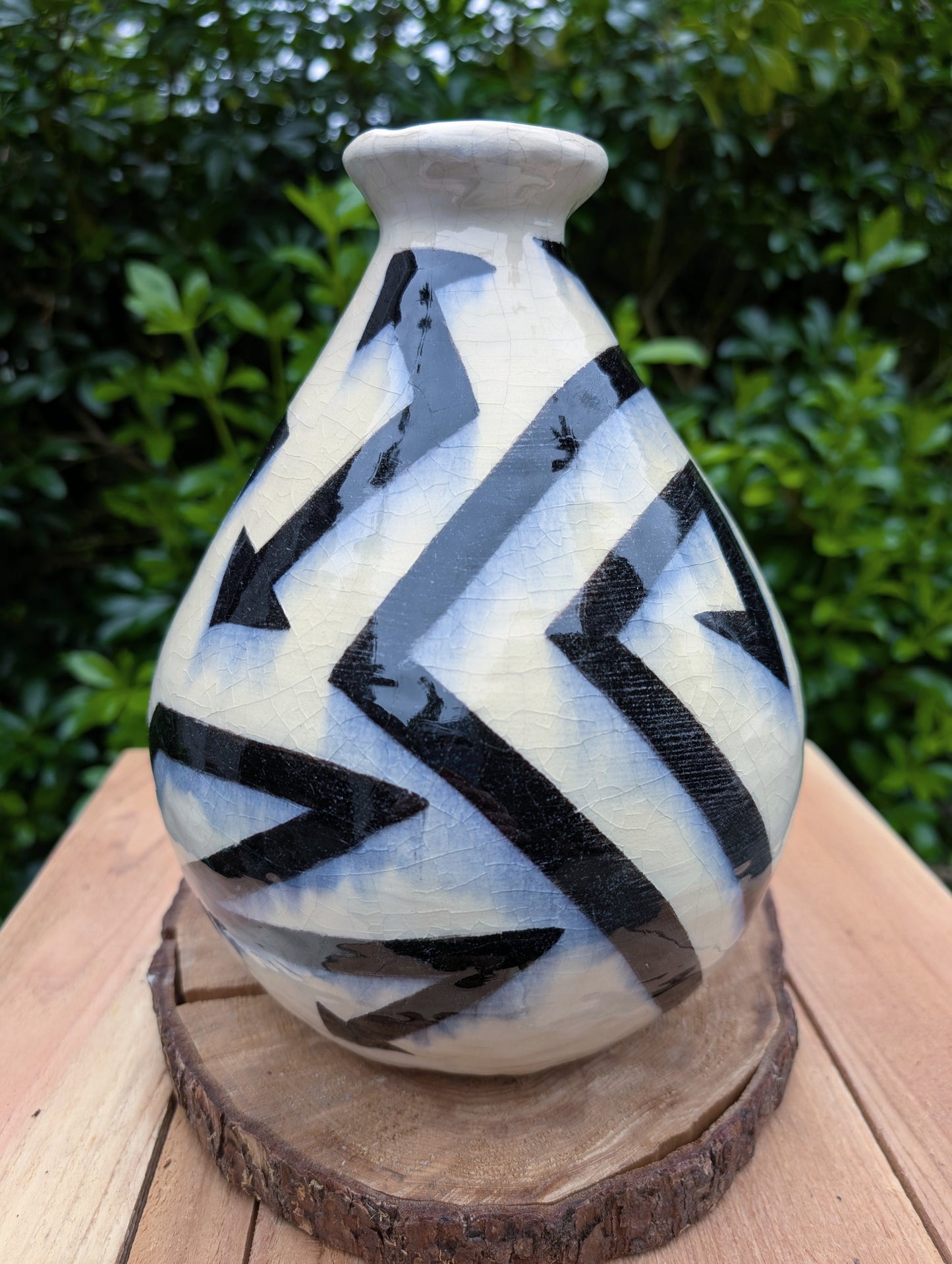 A striking signed studio pottery vase created by Sarah Palman in 1995, featuring bold black abstract arrow motifs over an ivory crackle glaze. This handcrafted ceramic sculpture blends modern design with timeless craftsmanship, making it equally beautiful displayed alone or with dried botanicals.