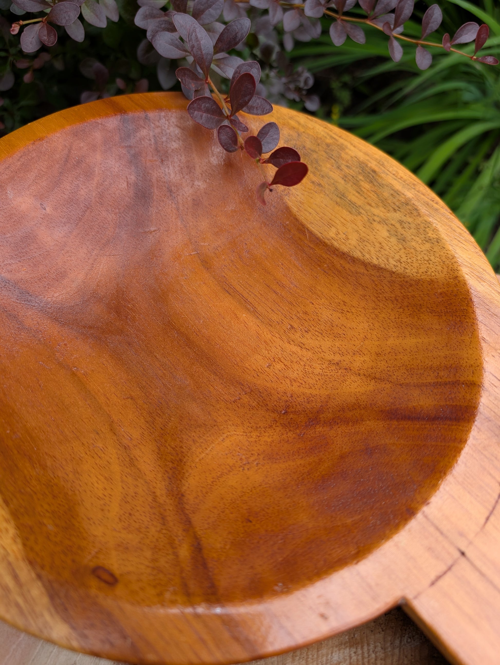 Serve with timeless style using this hand-carved Monkey Pod wood double serving tray. Crafted from a single piece of richly grained hardwood, its sculptural silhouette makes it equally beautiful as a serving piece or decorative centerpiece.