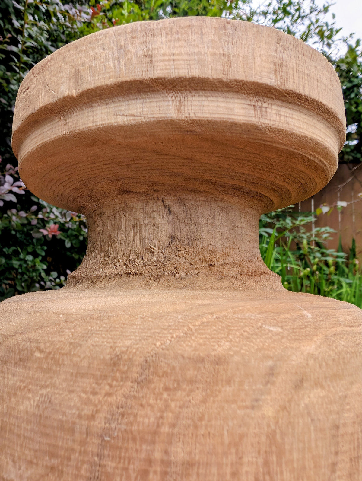 Bring natural warmth and organic texture into your home with this hand-carved paulownia wood footed vase. Its sculptural silhouette and unfinished wood grain make it a timeless accent for dried botanicals, seasonal branches, or as a beautiful standalone decorative piece.