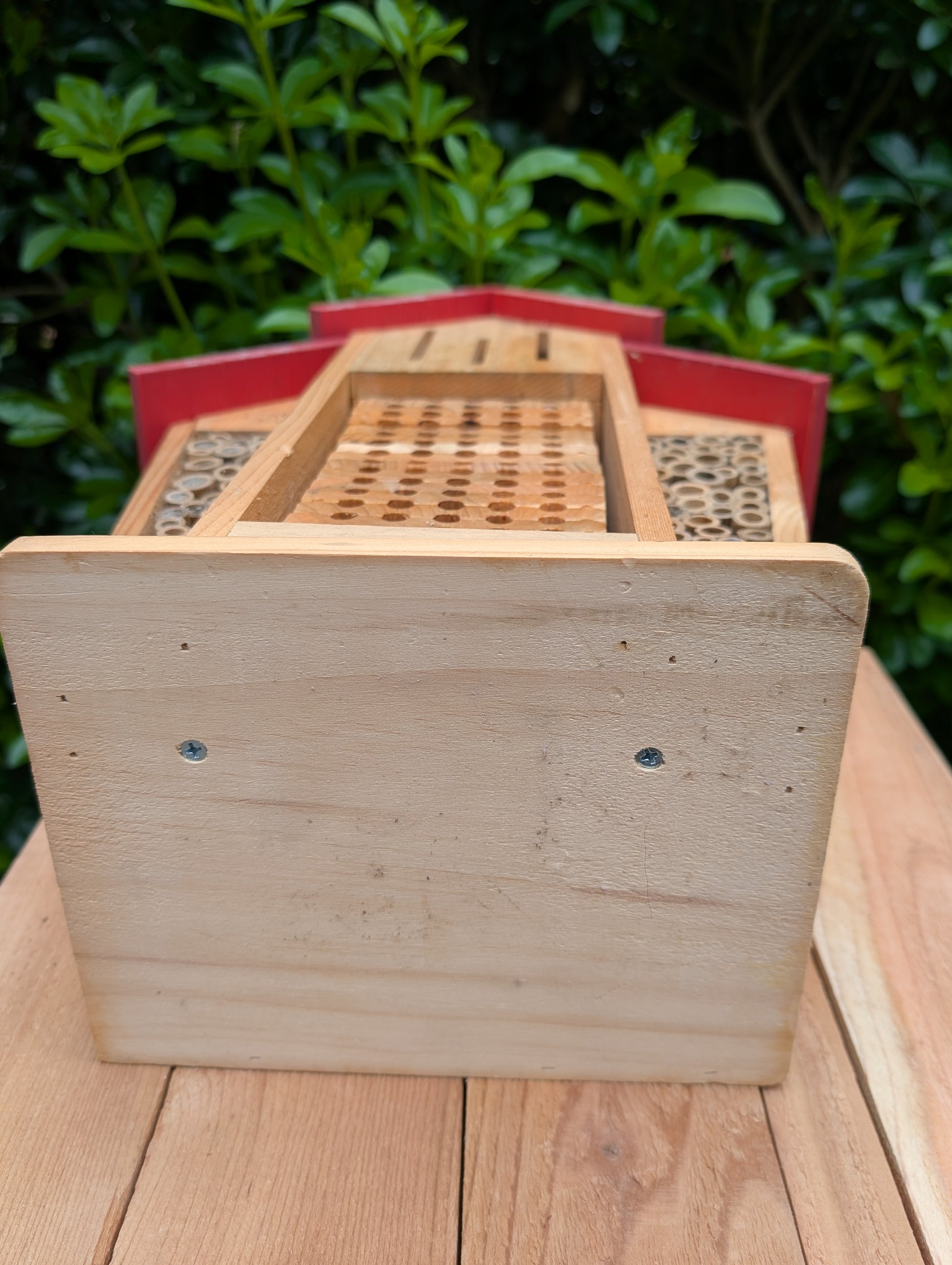 Create a welcoming refuge for native pollinators with this multi-chamber wooden insect hotel. Designed for solitary bees, butterflies, and other beneficial insects, it brings both natural beauty and ecological purpose to any garden or patio.