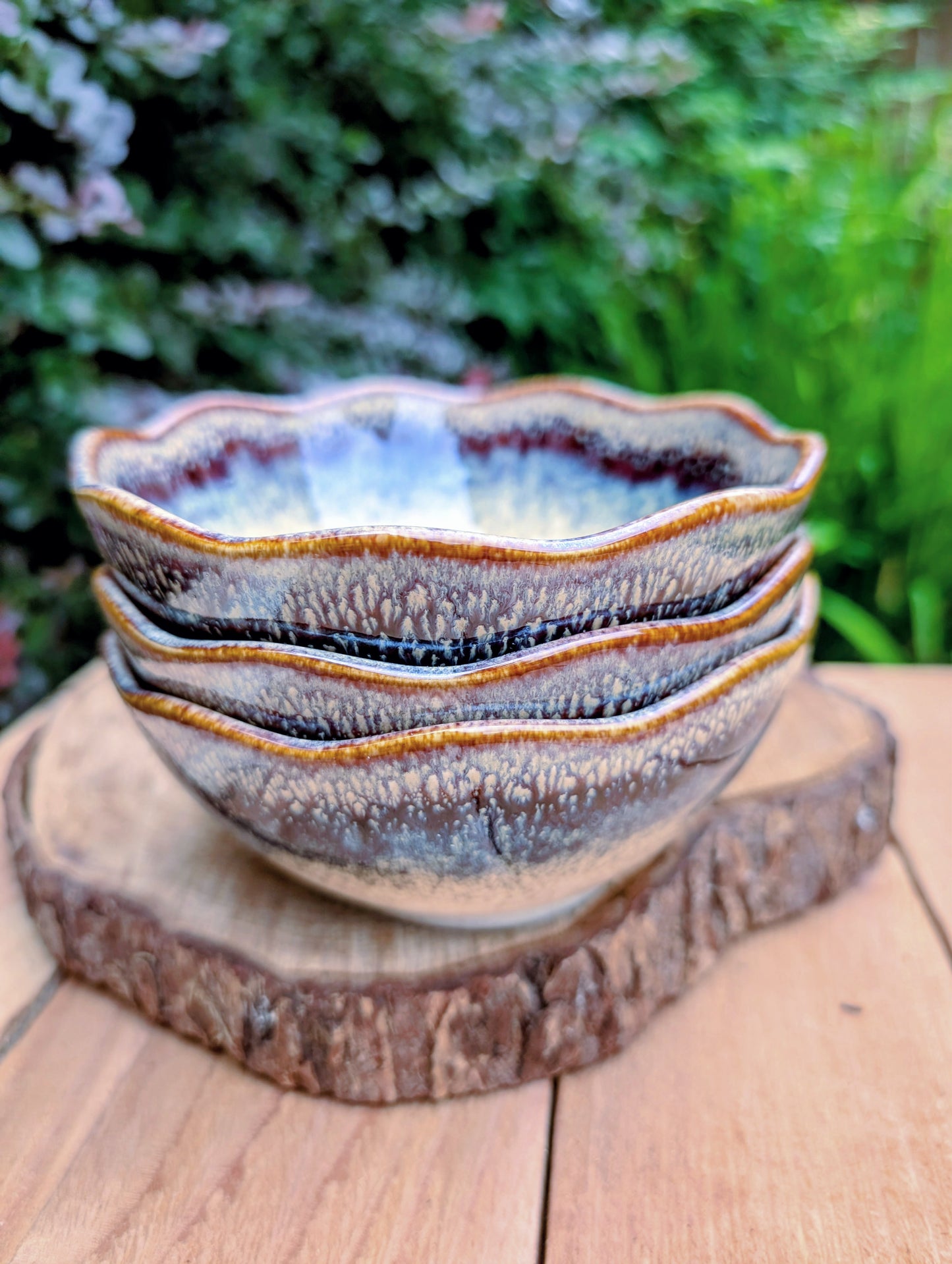 Bring understated elegance to everyday dining with this set of three RIRAKU stackable stoneware bowls. Featuring organically scalloped rims and beautifully layered reactive glazes inspired by traditional Japanese pottery, these versatile bowls are perfect for soups, rice, snacks, desserts, and small shared dishes.