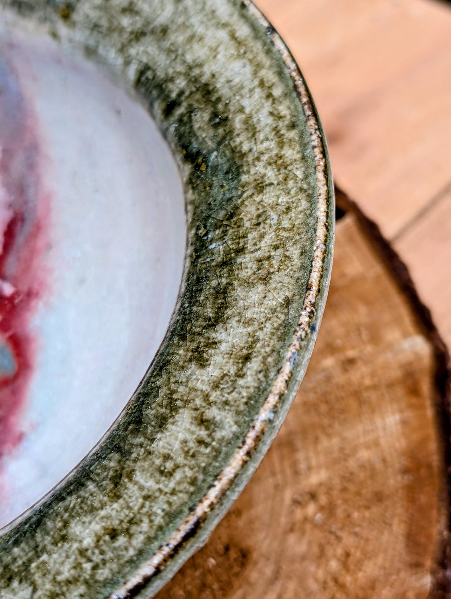Handcrafted with timeless simplicity, this signed studio pottery serving bowl pairs a soft celadon-gray glaze with a warm iron-rich stoneware body. Its versatile size and understated design make it equally beautiful for serving, display, or everyday living.