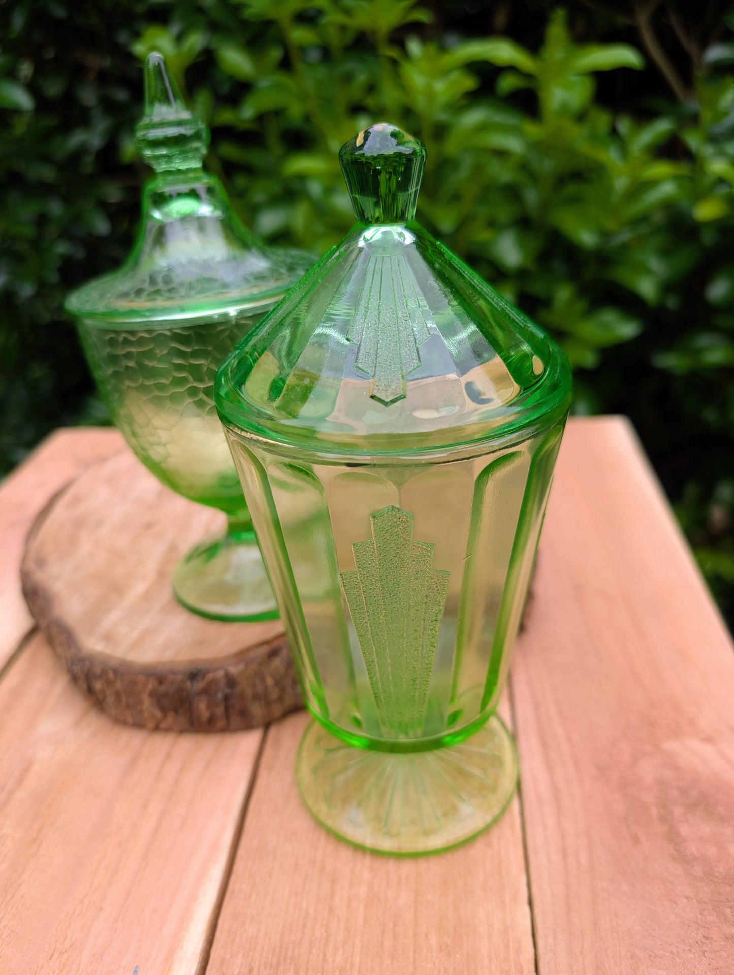 Two beautiful vintage emerald green covered pedestal candy dishes are offered in one convenient listing. Choose between a textured crackle glass design or an elegant Art Deco geometric pattern—each sold individually and carefully curated for collectors and vintage home décor enthusiasts.