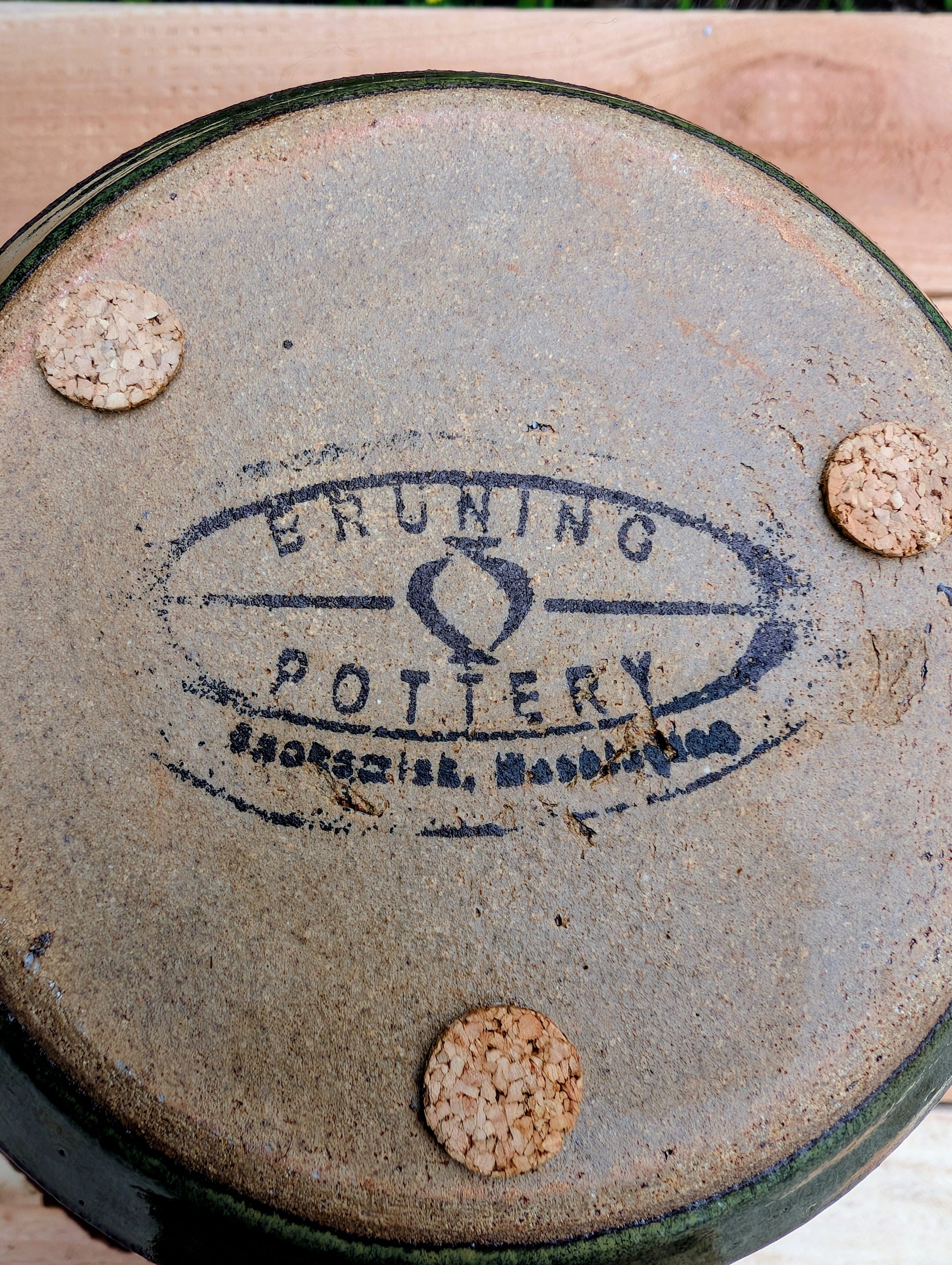 Handcrafted in Snohomish, Washington, this authentic Bruning Pottery stoneware planter showcases flowing moss green, olive, brown, and plum glazes inspired by the Pacific Northwest landscape. Complete with an integrated saucer, it's a beautiful and functional piece for houseplants, herbs, or succulent collections.