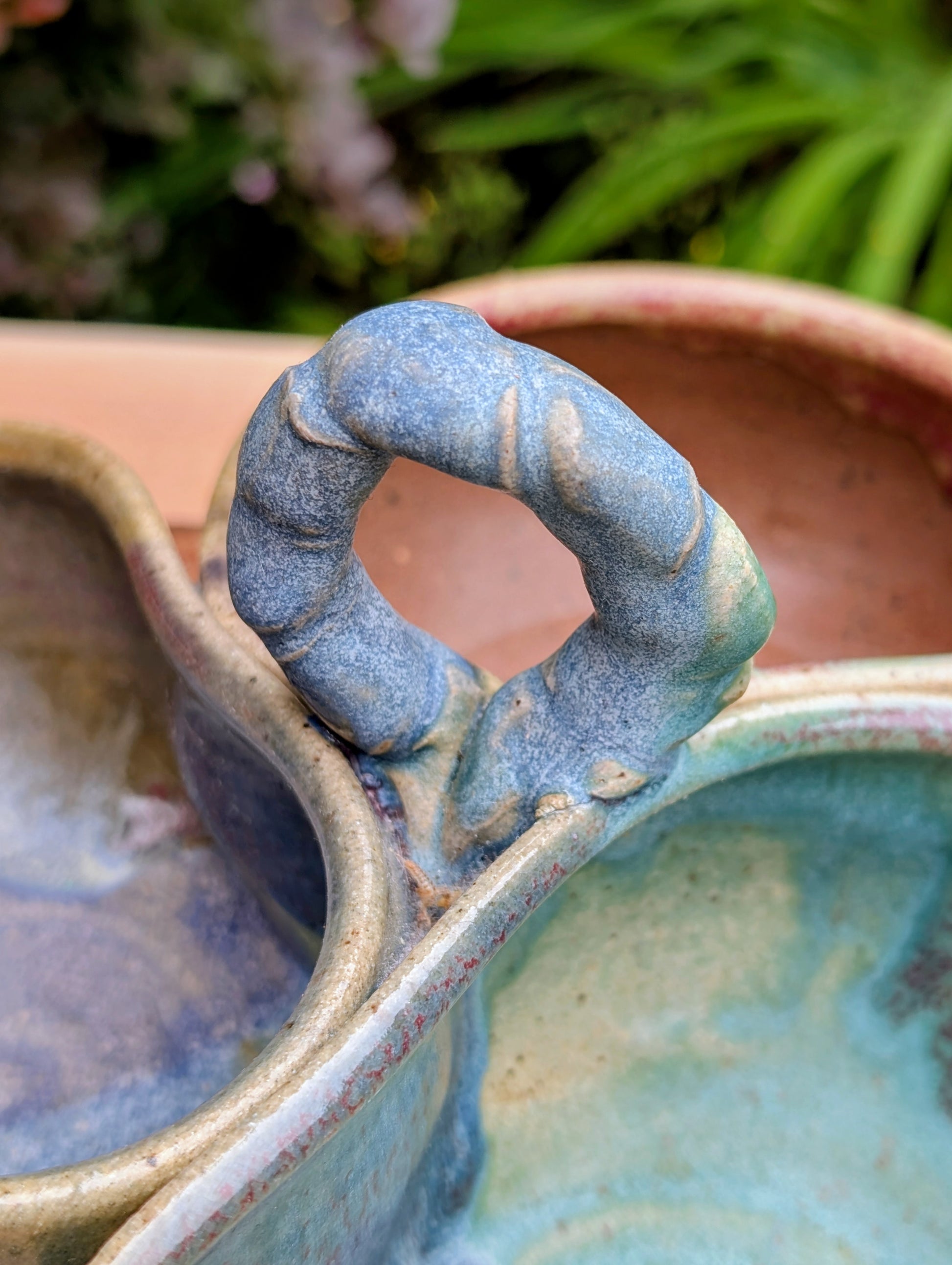 Beautifully handcrafted and artist signed, this three-bowl stoneware condiment server combines sculptural artistry with everyday functionality. Finished in layered seafoam, aqua, moss, and earthy glazes, it brings timeless craftsmanship and Pacific Northwest-inspired beauty to entertaining.