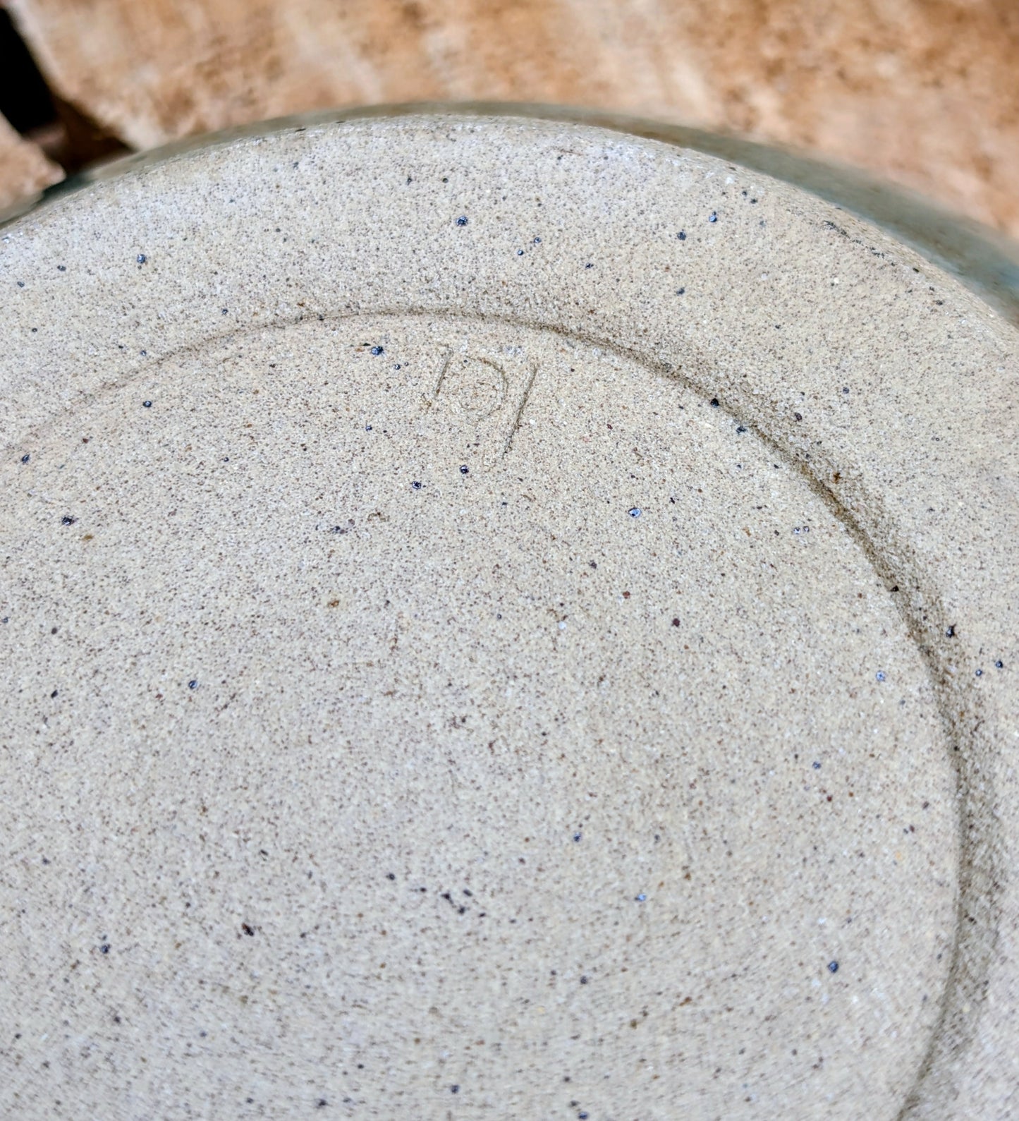Bring the calming colors of the Pacific Northwest into your home with this handcrafted studio pottery bowl. Featuring layered blue, aqua, cream, and olive reactive glazes, this artisan stoneware piece is equally beautiful as a serving bowl or decorative display.