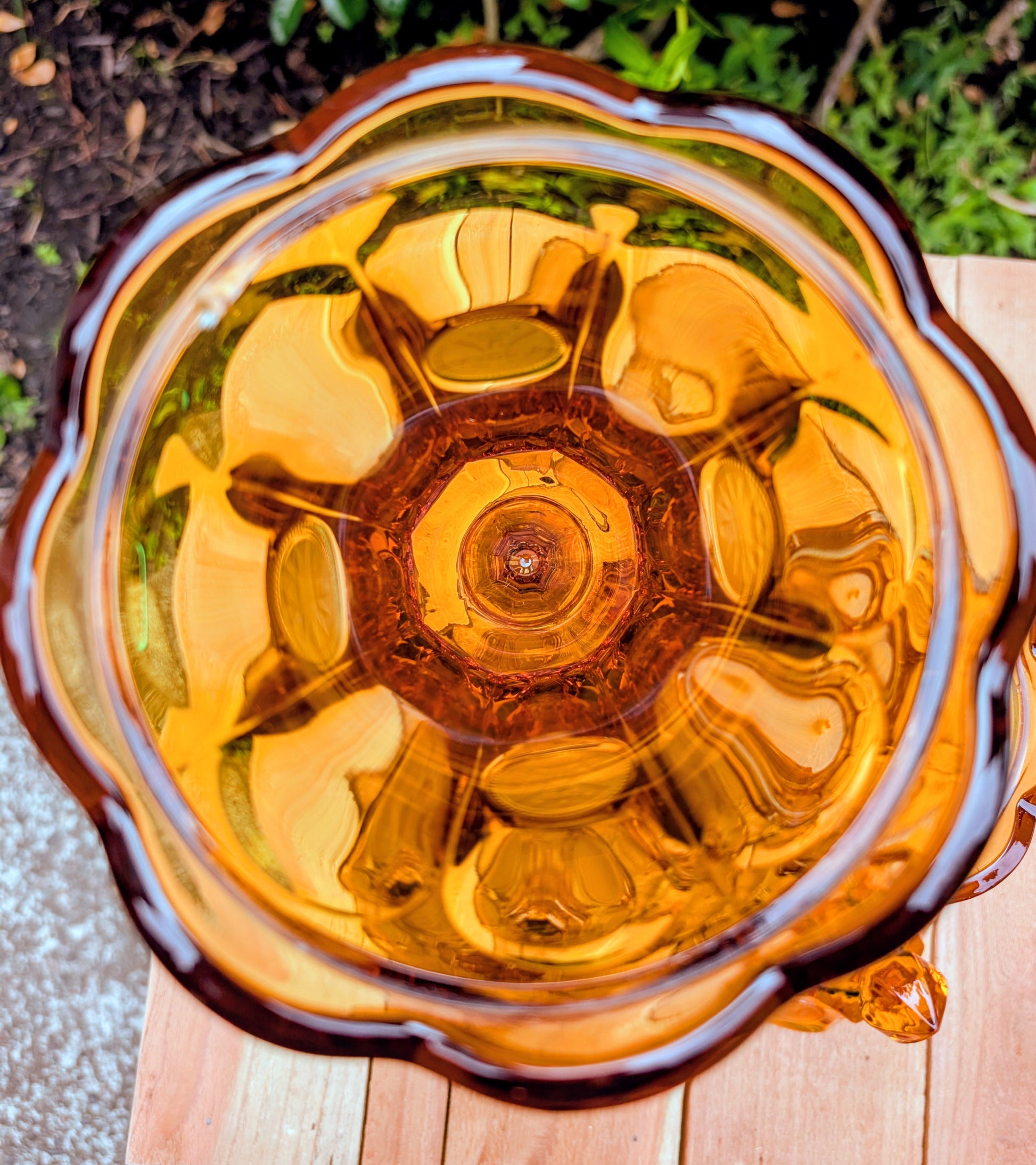 A stunning matching set of vintage Indiana Glass in the iconic Kings Crown (Coin) pattern. This coordinated amber glass collection includes a covered pedestal vase and matching covered candy dish, each with its original lid. A beautiful Mid-Century display for collectors and vintage home décor enthusiasts.
