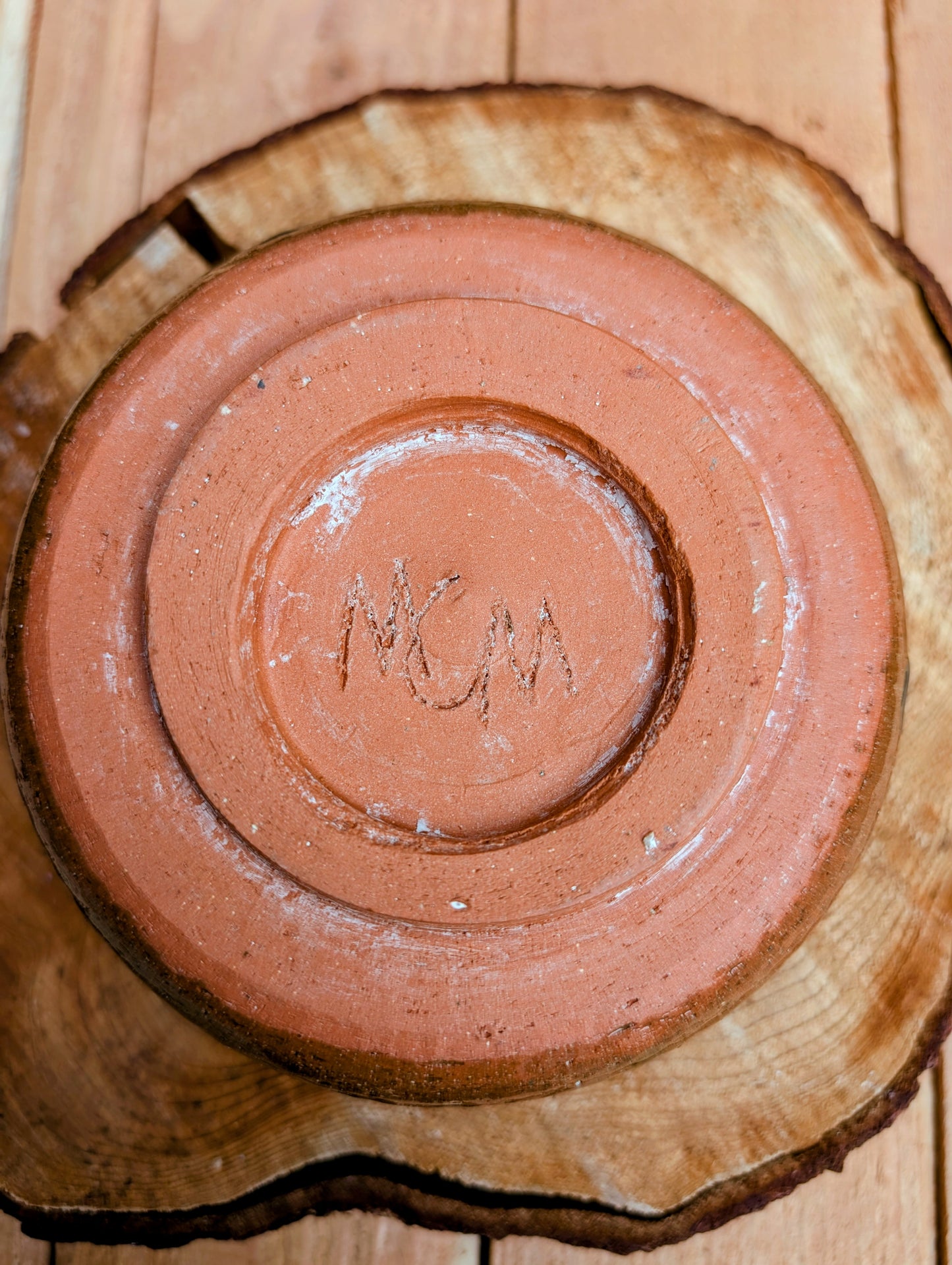 Handcrafted with richly carved texture and a soft blue reactive glaze, this signed studio pottery bowl brings warmth and character to any home. Ideal as a serving bowl, decorative accent, or functional piece of everyday artisan pottery.