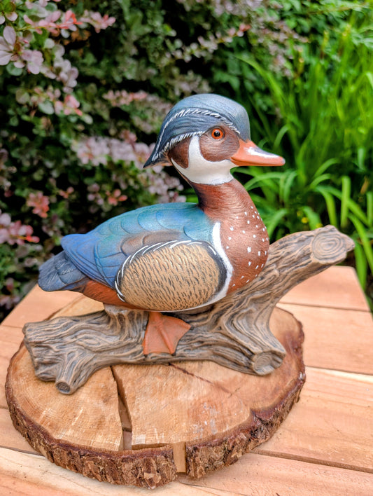 Celebrate the beauty of North American wetlands with this hand-painted ceramic Wood Duck sculpture, dated 1969 and mounted on a sculpted faux driftwood log. Richly detailed and full of rustic charm, it makes a wonderful addition to lodge, cabin, or nature-inspired décor.