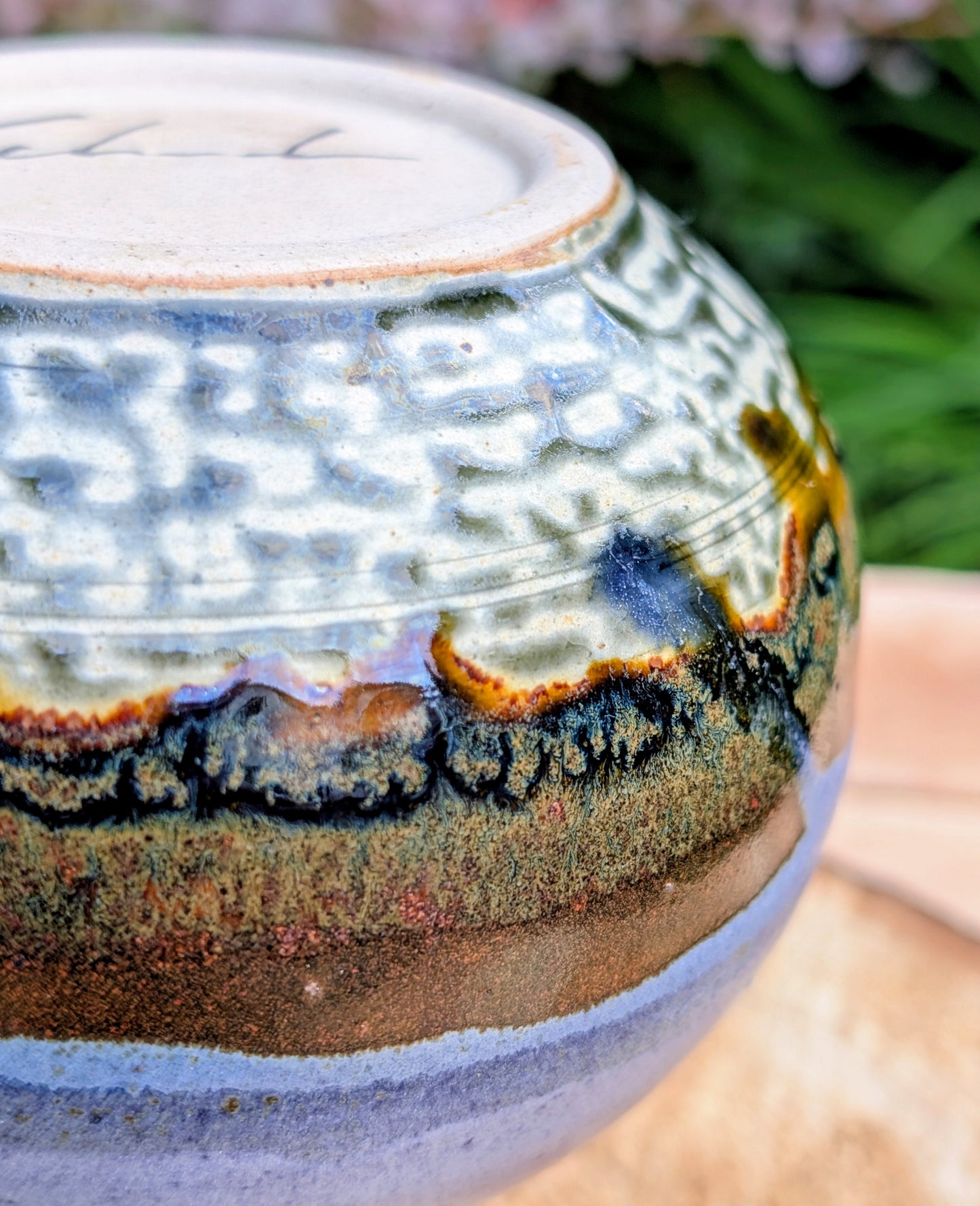 A beautifully signed studio pottery bud vase featuring a softly rounded bubble form and layered landscape-inspired glazes. Its organic silhouette and calming palette make it an elegant accent for modern, minimalist, and nature-inspired interiors.