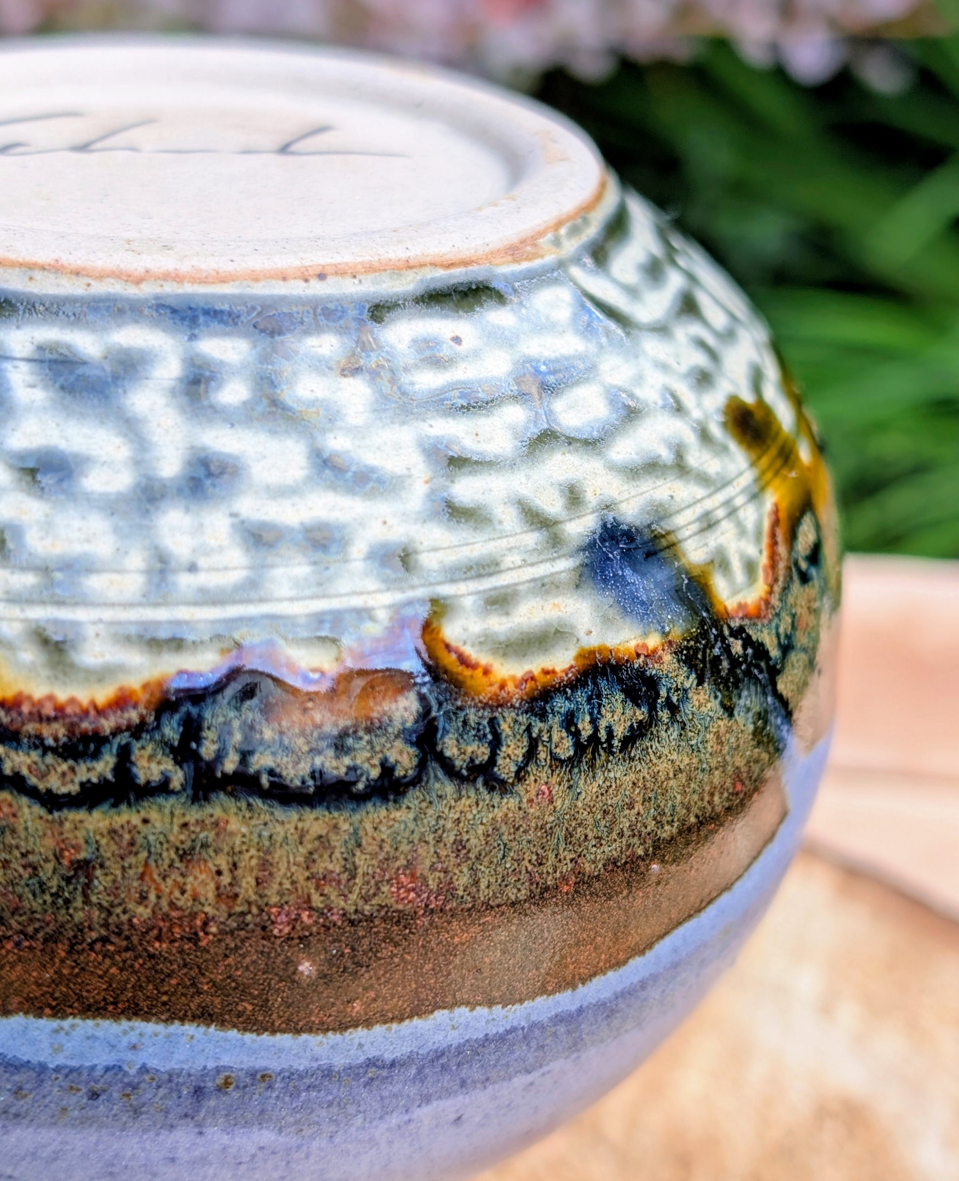 A beautifully signed studio pottery bud vase featuring a softly rounded bubble form and layered landscape-inspired glazes. Its organic silhouette and calming palette make it an elegant accent for modern, minimalist, and nature-inspired interiors.