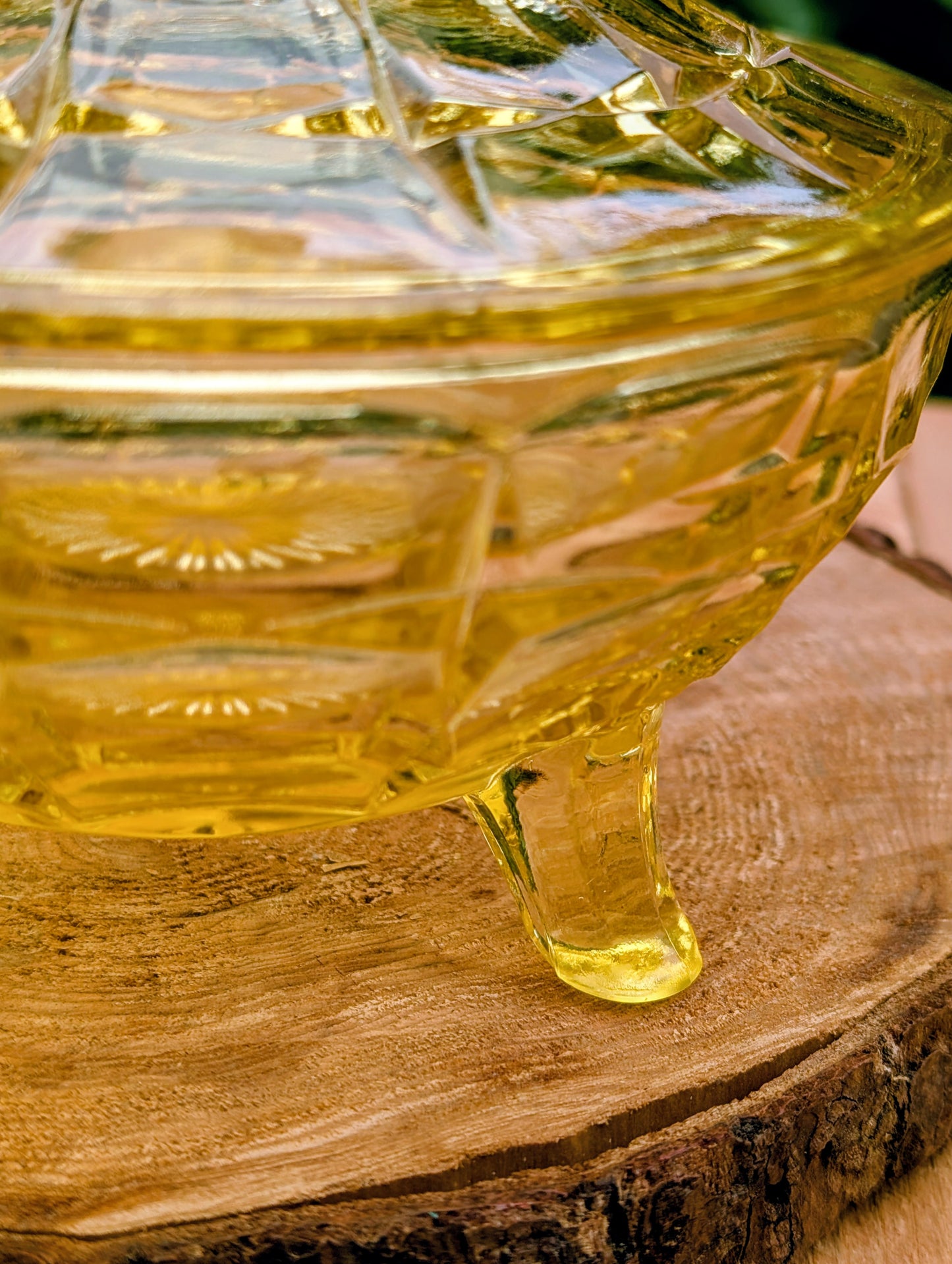 Bring warm vintage charm to your home with this beautiful Tiara Exclusives Constellation covered candy dish in the sought-after Yellow Mist color. Produced by Indiana Glass during the 1970s, its geometric star pattern and golden glow make it a timeless piece for entertaining or display.