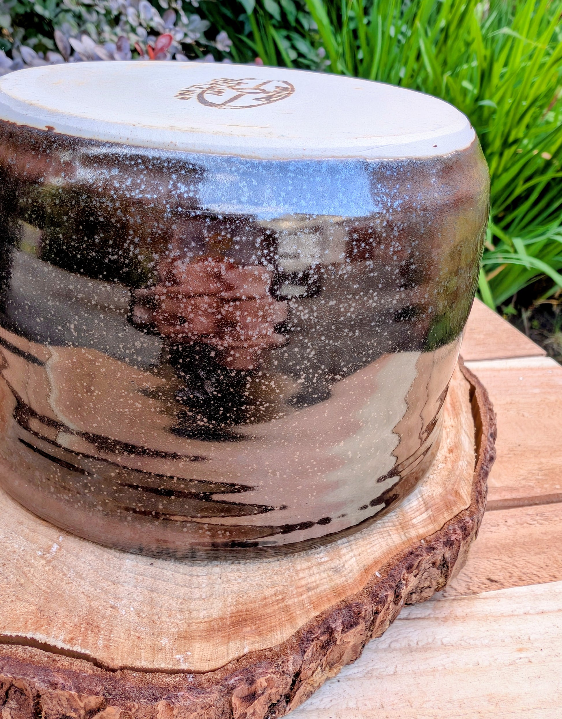 Bring the warmth of Pacific Northwest craftsmanship to your home with this authentic Bruning Pottery stoneware bowl from the studio's Seattle era. Featuring a rich iron-speckled glaze and wheel-thrown construction, it's equally beautiful as a serving bowl, planter cachepot, or decorative display piece.