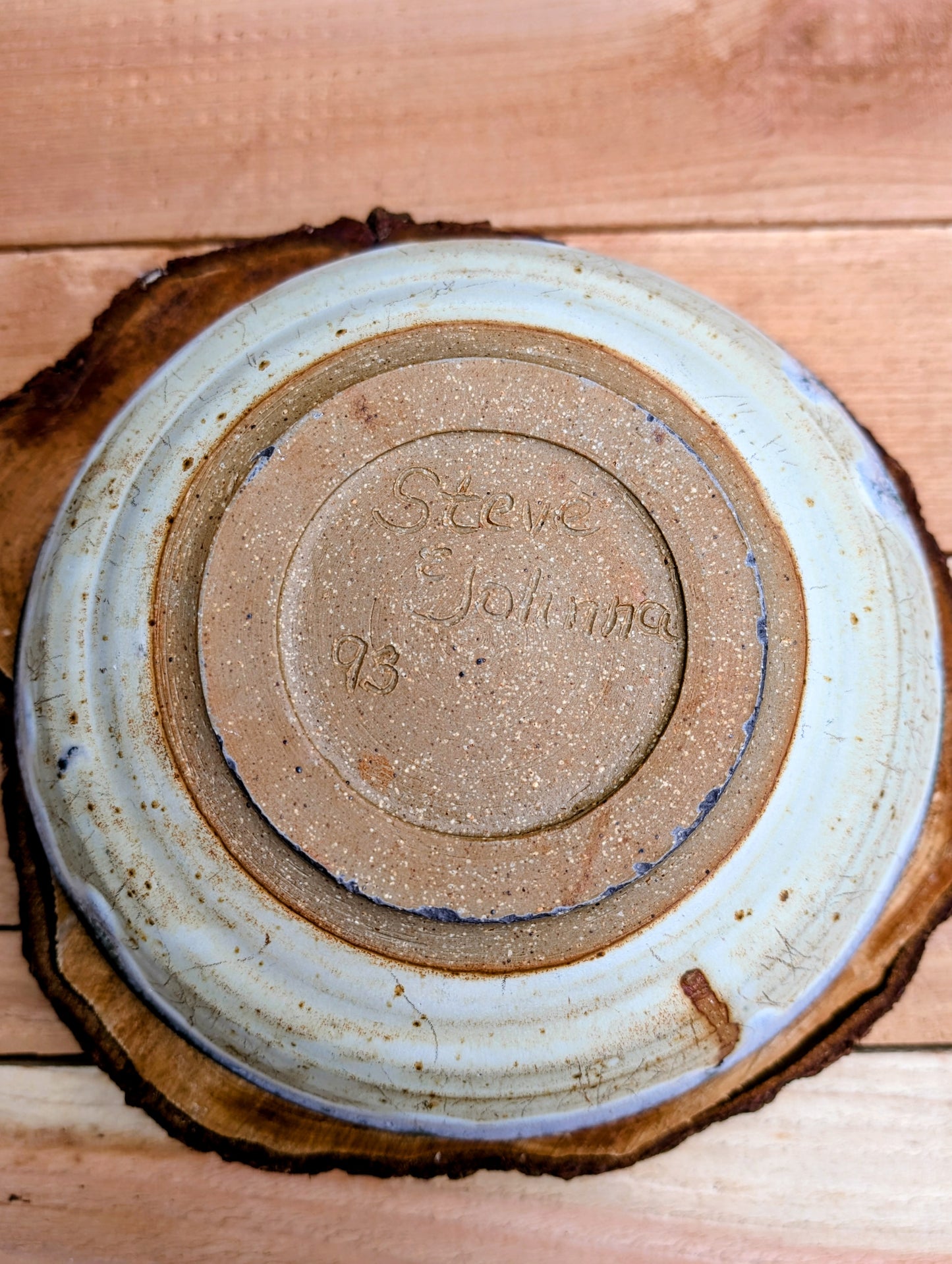 A beautifully handcrafted studio pottery bowl signed by Steve & Johnna and dated 1993. Featuring layered forest green, lavender-blue, and cream glazes, this wheel-thrown stoneware piece embodies the timeless beauty of American studio ceramics and is equally suited for everyday use or display.