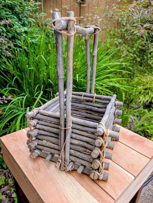 A beautifully handcrafted twig gathering basket that brings rustic warmth and natural texture to your home or garden. Perfect for displaying potted plants, seasonal décor, dried botanicals, or everyday storage, this versatile basket celebrates timeless craftsmanship and Pacific Northwest-inspired living.
