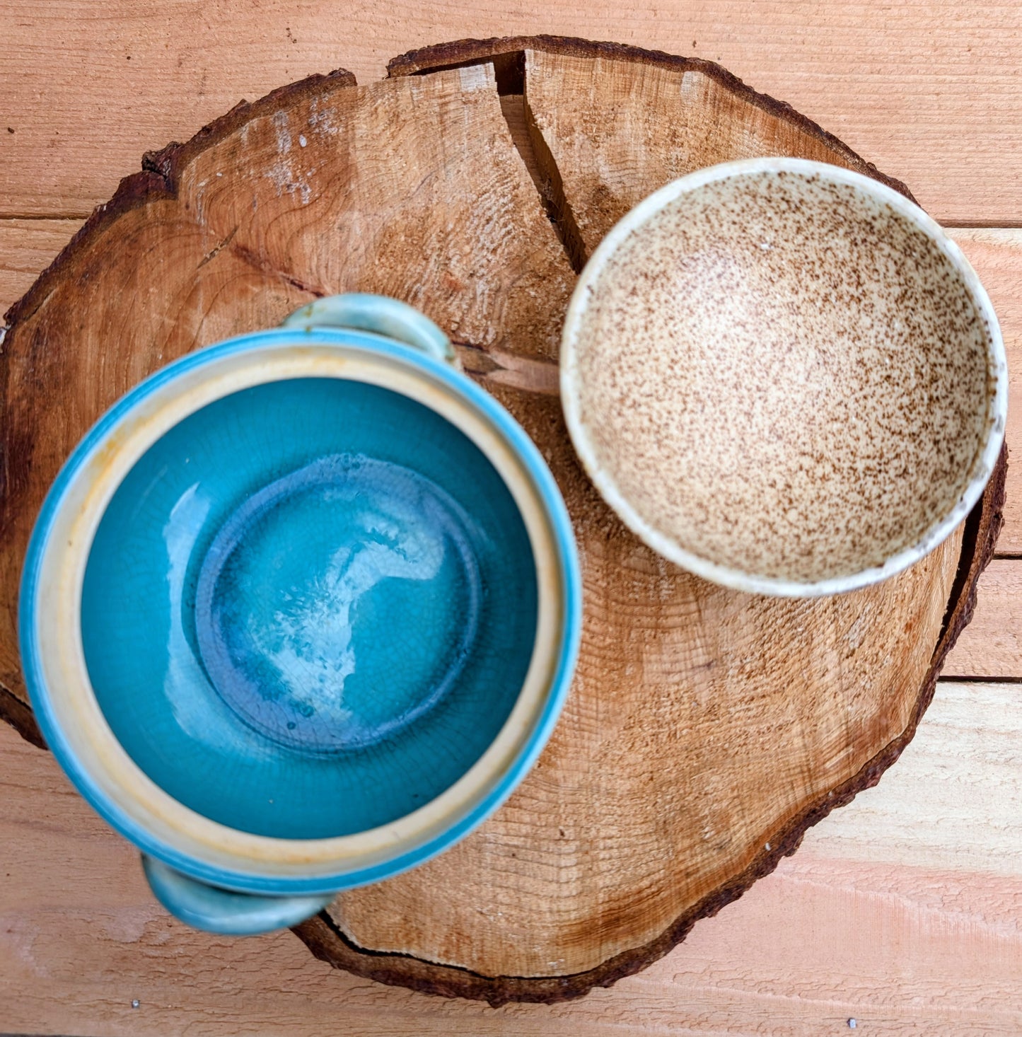 A beautifully handcrafted studio pottery bowl featuring a warm speckled stoneware exterior, vibrant turquoise glazed interior, and matching ribbed lid. Its compact size and organic design make it perfect for serving small dishes or displaying as a timeless piece of artisan pottery.