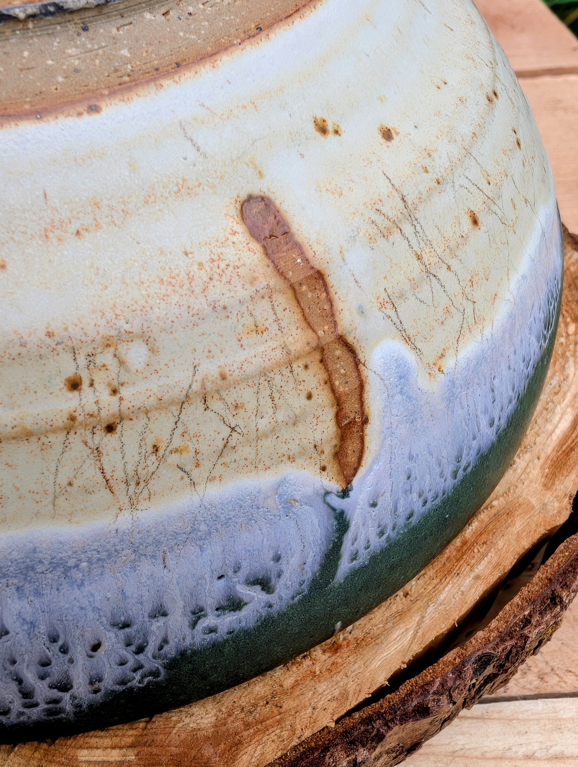 A beautifully handcrafted studio pottery bowl signed by Steve & Johnna and dated 1993. Featuring layered forest green, lavender-blue, and cream glazes, this wheel-thrown stoneware piece embodies the timeless beauty of American studio ceramics and is equally suited for everyday use or display.