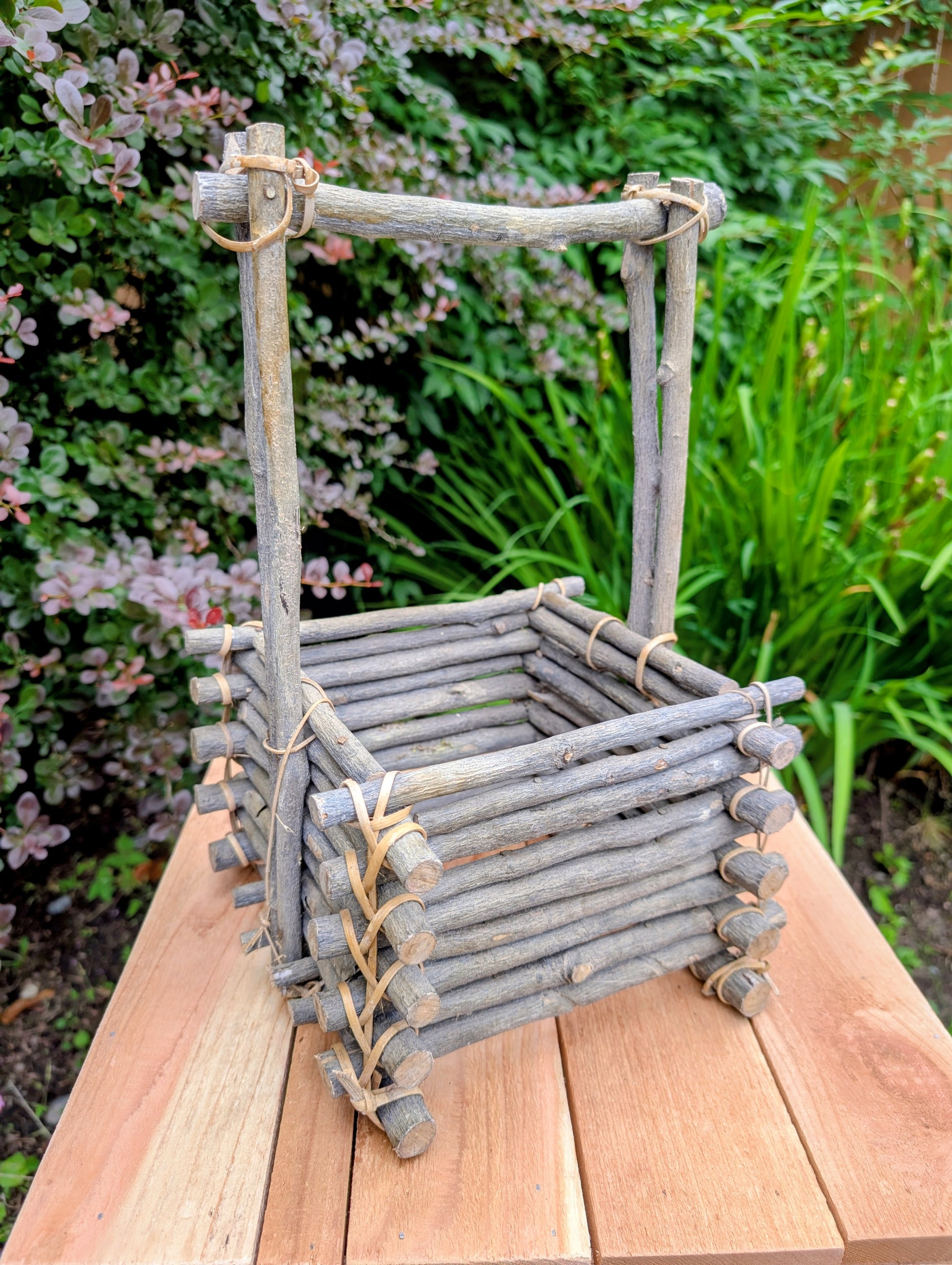A beautifully handcrafted twig gathering basket that brings rustic warmth and natural texture to your home or garden. Perfect for displaying potted plants, seasonal décor, dried botanicals, or everyday storage, this versatile basket celebrates timeless craftsmanship and Pacific Northwest-inspired living.