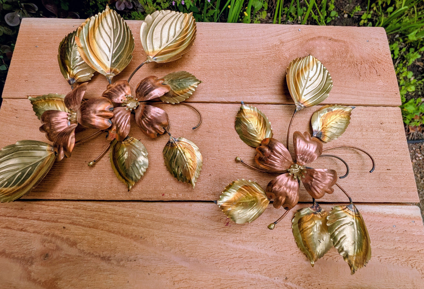 Bring the warmth of 1970s botanical décor into your home with this charming pair of vintage brass and copper-tone dogwood wall sculptures. Their delicate floral design and mixed-metal finish make them an easy addition to Mid-Century Modern, cottage, and nature-inspired interiors.