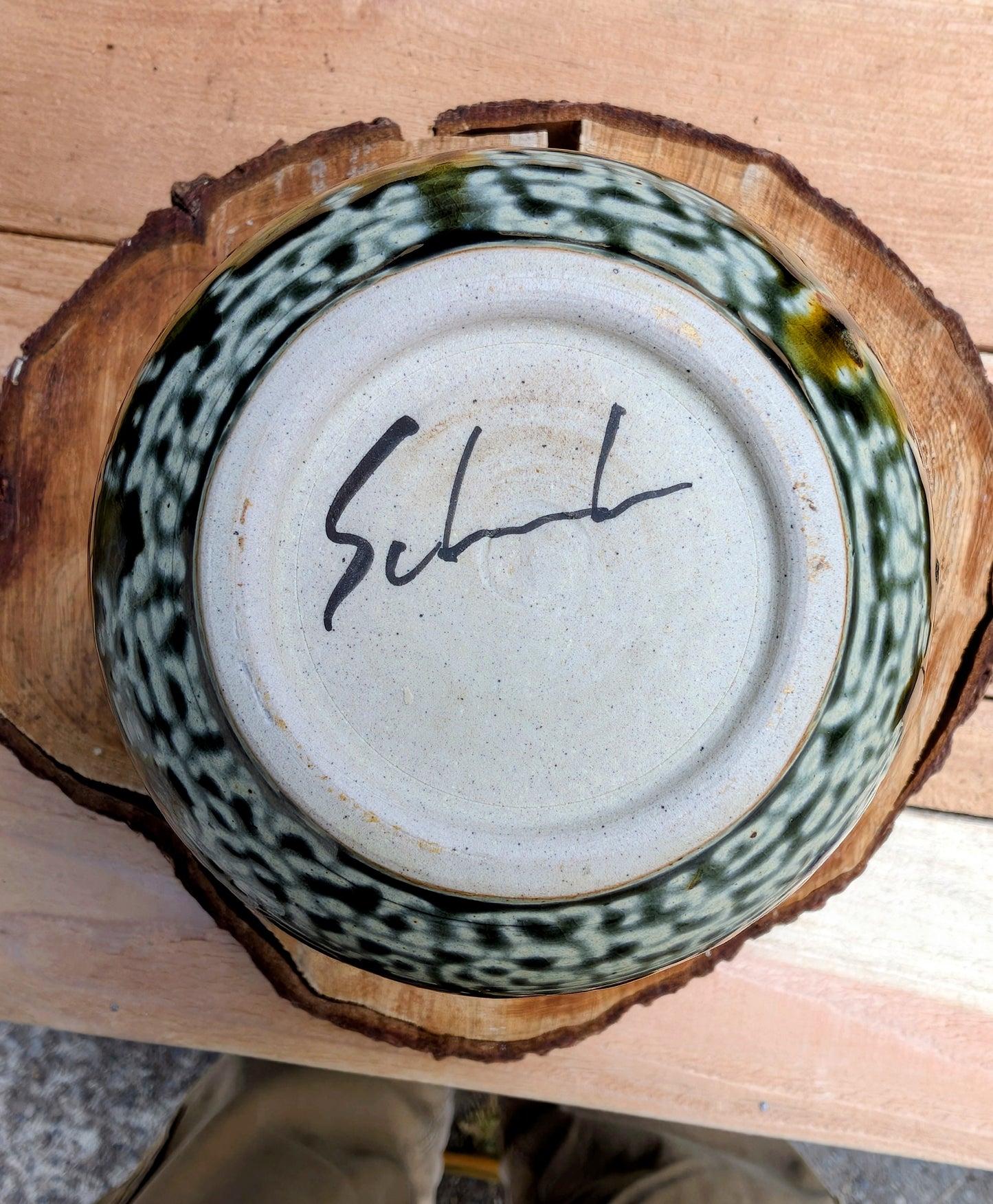 A beautifully signed studio pottery bud vase featuring a softly rounded bubble form and layered landscape-inspired glazes. Its organic silhouette and calming palette make it an elegant accent for modern, minimalist, and nature-inspired interiors.