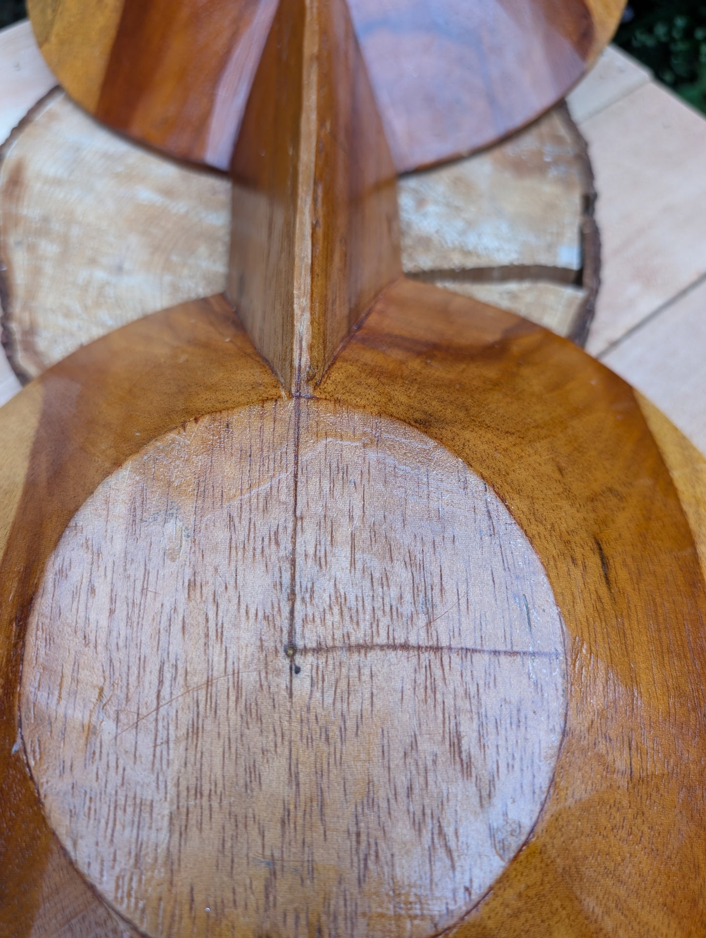 Serve with timeless style using this hand-carved Monkey Pod wood double serving tray. Crafted from a single piece of richly grained hardwood, its sculptural silhouette makes it equally beautiful as a serving piece or decorative centerpiece.