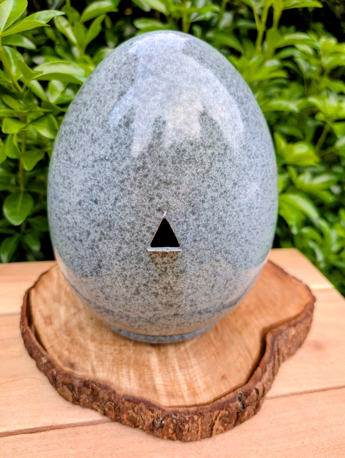 Bring sculptural beauty to your garden with the Alcyon Egg Bird Home by Byer of Maine. Its smooth glazed ceramic finish and distinctive egg-shaped design create a welcoming retreat for small birds while adding timeless charm to any outdoor space.