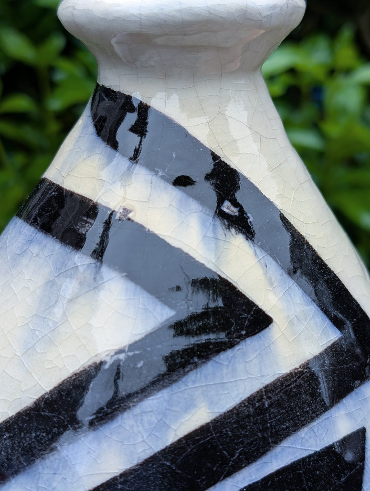 A striking signed studio pottery vase created by Sarah Palman in 1995, featuring bold black abstract arrow motifs over an ivory crackle glaze. This handcrafted ceramic sculpture blends modern design with timeless craftsmanship, making it equally beautiful displayed alone or with dried botanicals.