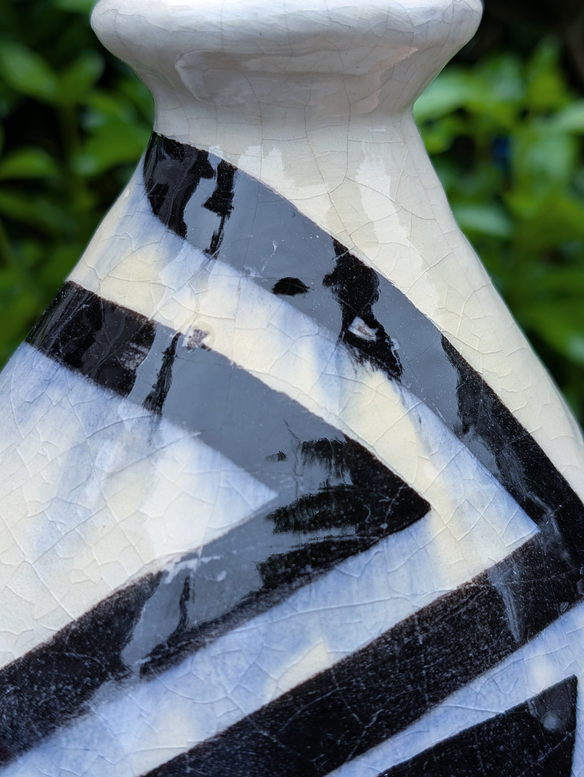 A striking signed studio pottery vase created by Sarah Palman in 1995, featuring bold black abstract arrow motifs over an ivory crackle glaze. This handcrafted ceramic sculpture blends modern design with timeless craftsmanship, making it equally beautiful displayed alone or with dried botanicals.