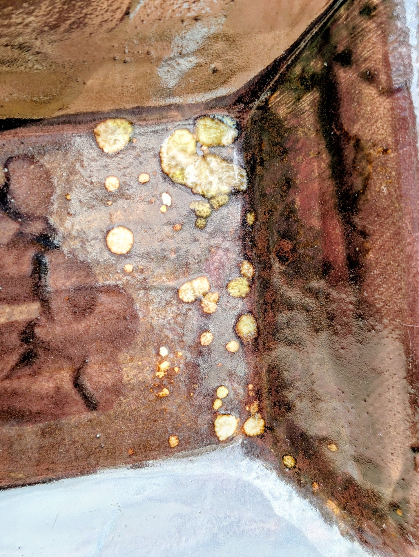 Celebrate the beauty of handcrafted ceramics with this square studio pottery dish featuring layered reactive glazes in rich chocolate brown, gray, olive, cream, and golden crystalline accents. Perfect as a catchall tray, jewelry dish, appetizer plate, or decorative accent, it brings organic warmth to any space.
