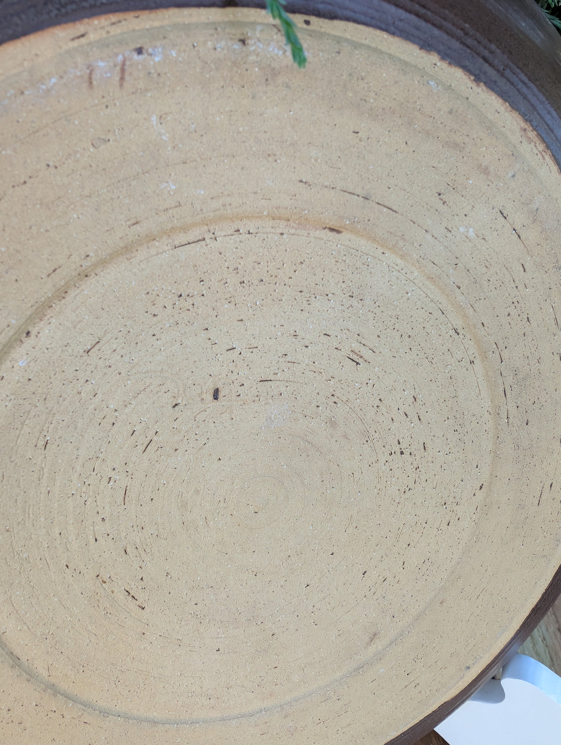 Celebrate the beauty of handmade craftsmanship with this one-of-a-kind studio pottery art plate featuring an expressive abstract octopus-inspired design. Rich earth-tone glazes and visible throwing rings make this versatile stoneware piece equally at home as functional serveware or coastal-inspired wall décor.