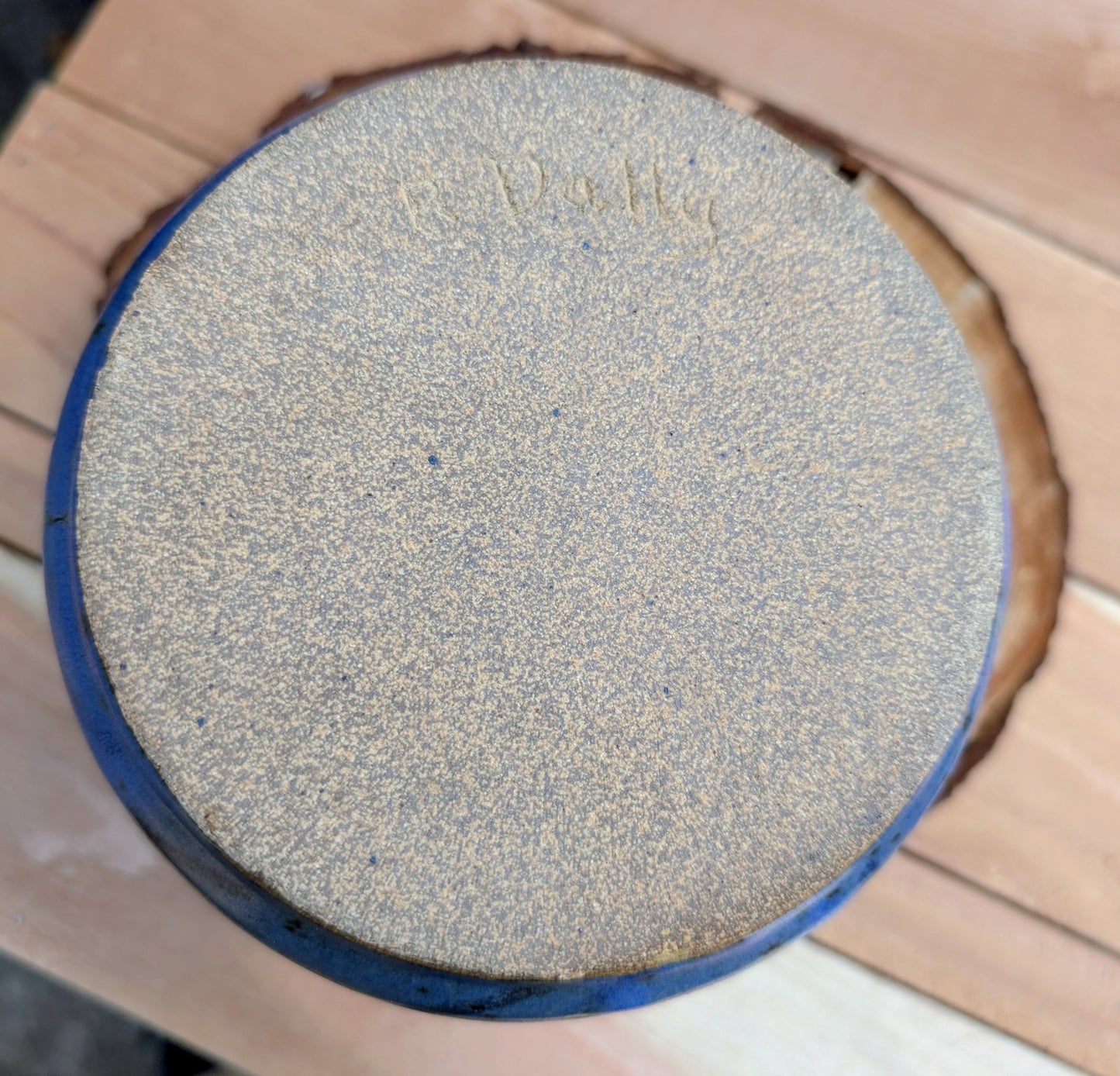 Handcrafted and artist-signed, this wheel-thrown stoneware vessel features a rich satin matte cobalt blue glaze accented with natural iron speckling. Originally created as a lidded storage jar, it now serves beautifully as a versatile open vessel for display or everyday use.