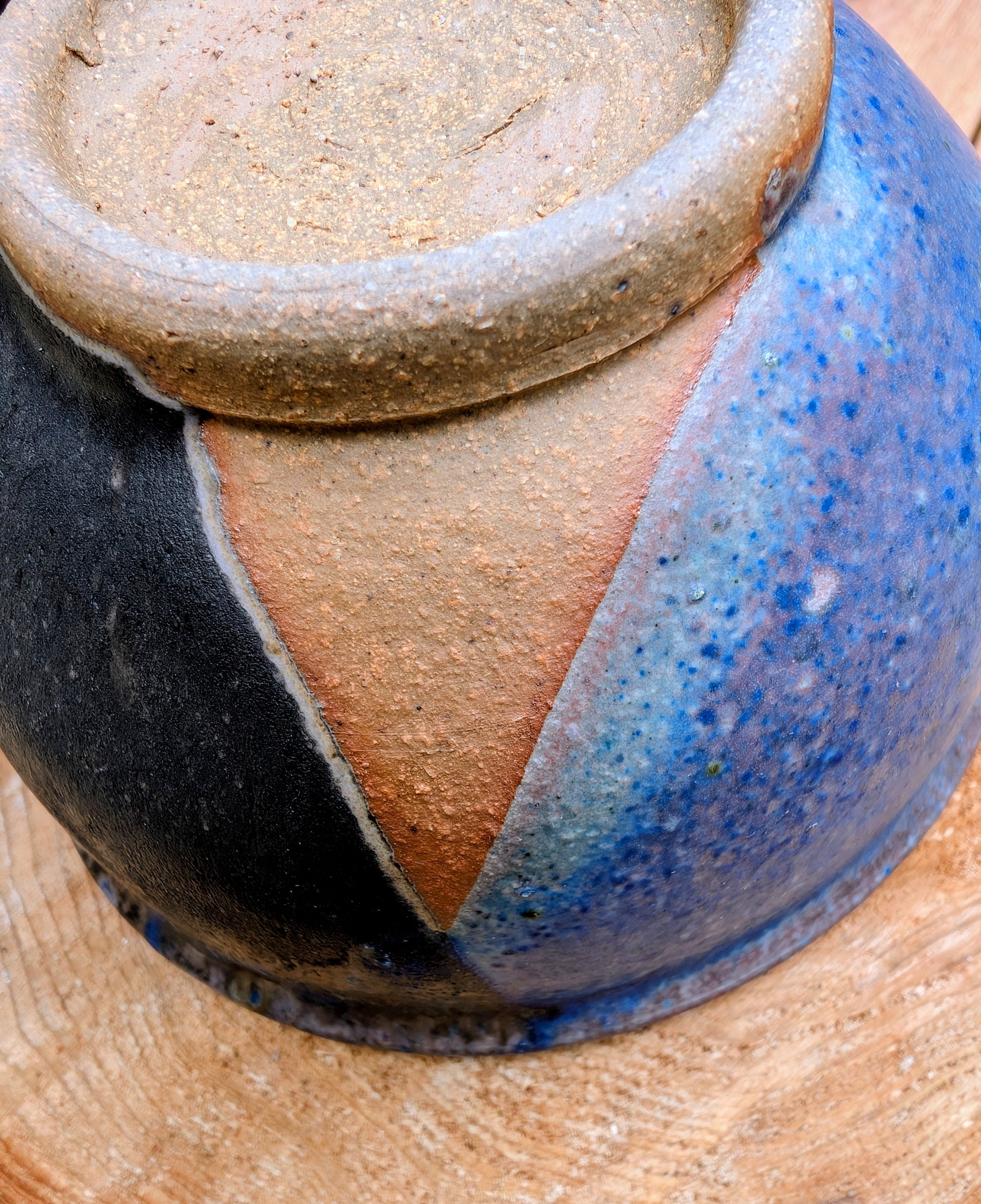 Bring handcrafted artistry to your home with this small footed studio pottery bowl featuring layered reactive glazes in purple, blue, charcoal, and earthy brown. Wheel-thrown from high-fired stoneware, its one-of-a-kind finish makes it equally beautiful as functional tableware or decorative art.