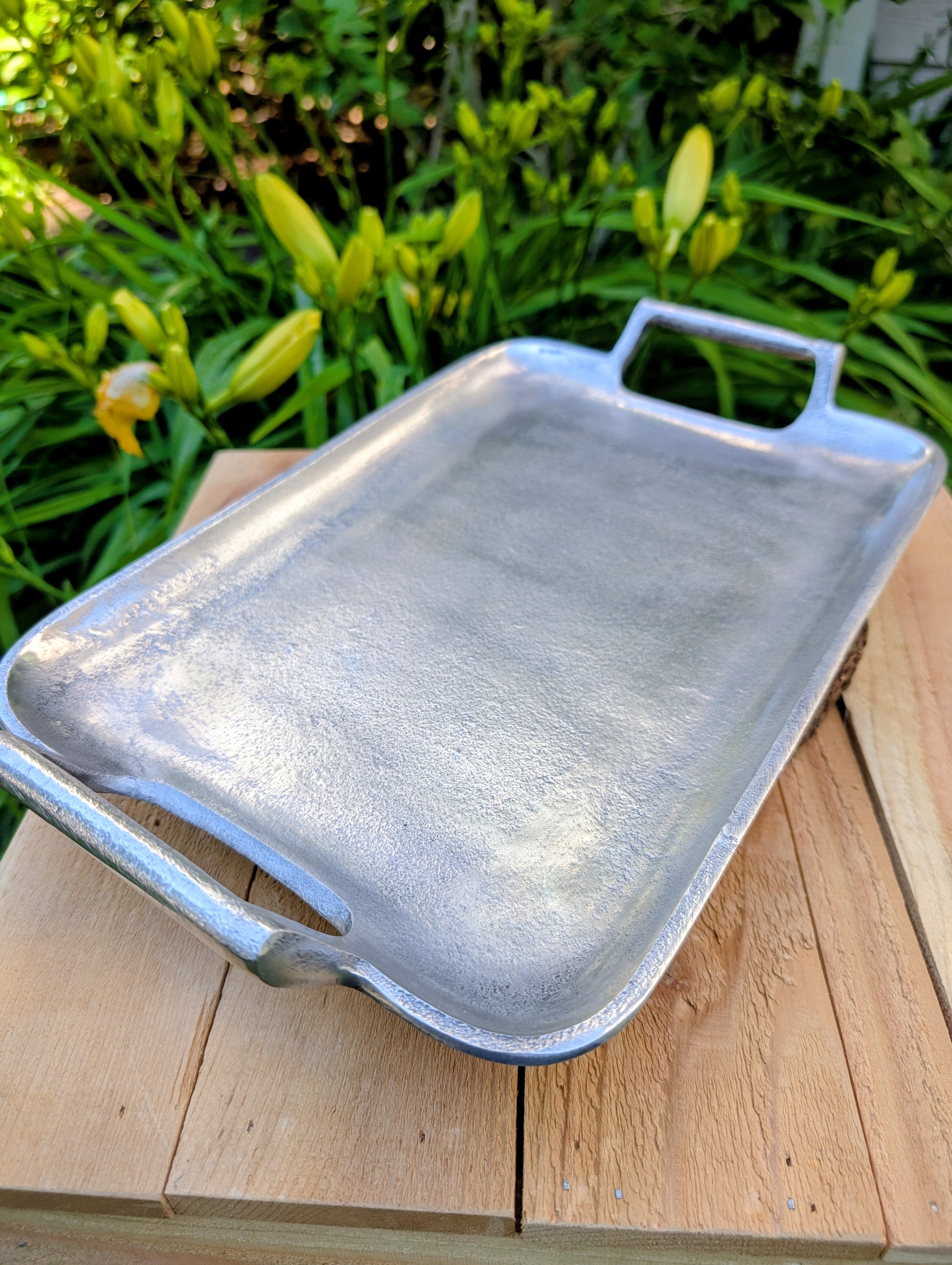 Bring timeless elegance to your garden or home with this vintage cast aluminum serving tray featuring a beautiful satin pewter finish and integrated handles. Originally designed for entertaining, it has been thoughtfully curated by Cedar & Song Studio as a versatile bird feeding tray, centerpiece, or decorative serving piece.