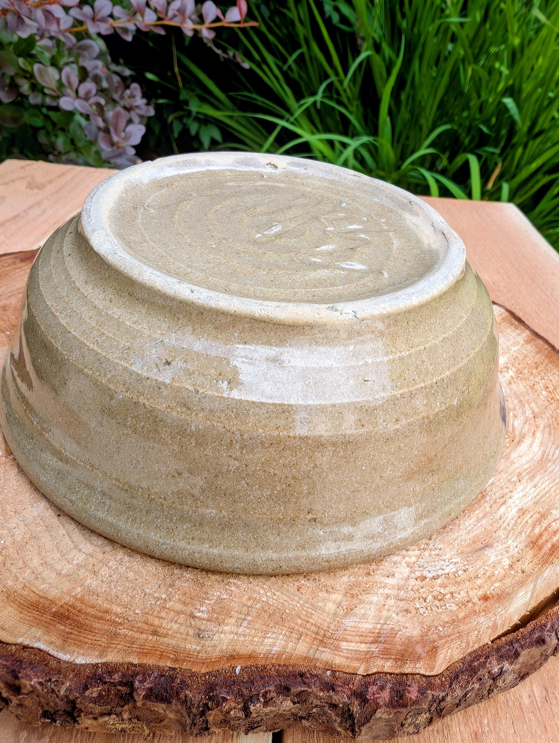 Bring handcrafted warmth to your table with this beautifully wheel-thrown studio pottery bowl, attributed to Gladstone Wear. Featuring flowing cobalt blue, charcoal, and earthy brown glazes over a natural buff stoneware body, it offers timeless artisan appeal for serving or display.