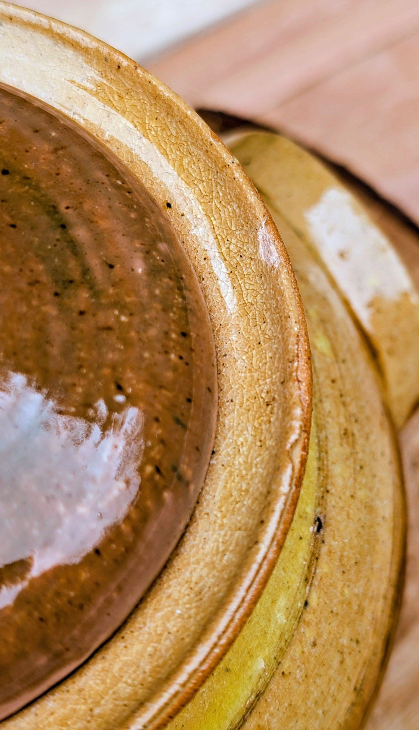 Bring timeless craftsmanship to your kitchen with this handcrafted studio pottery lidded stoneware pot. Finished in warm honey, caramel, olive, and tan glazes, this versatile covered vessel is equally beautiful as functional serveware or rustic farmhouse décor.