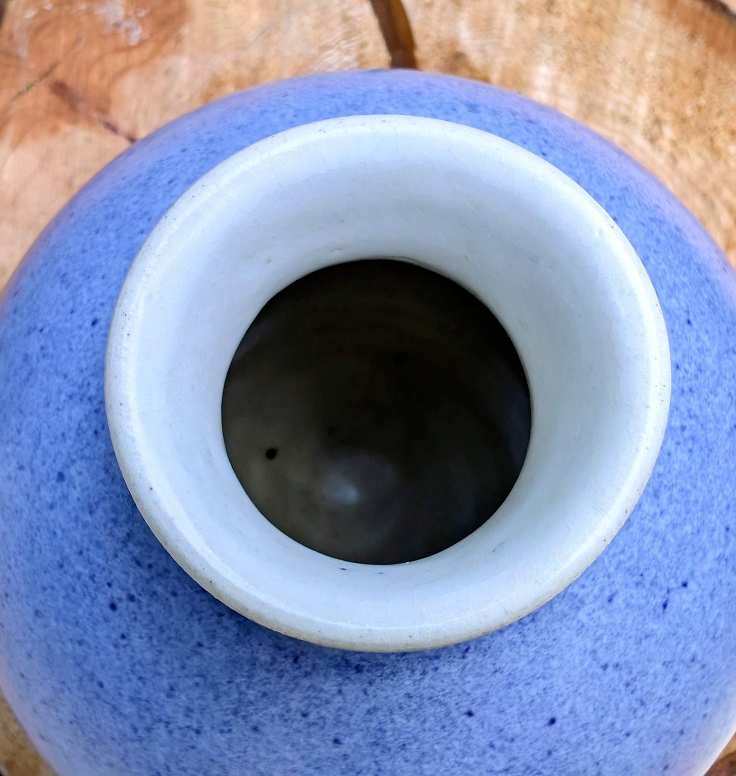 A beautifully signed studio pottery bud vase featuring a softly rounded bubble form and layered landscape-inspired glazes. Its organic silhouette and calming palette make it an elegant accent for modern, minimalist, and nature-inspired interiors.