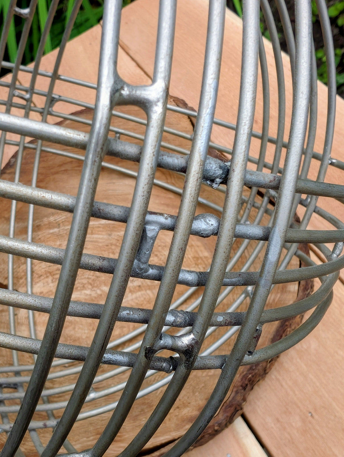 Bring sculptural simplicity to your home or garden with this stainless steel wire sphere. Its clean geometric design adds year-round visual interest, whether displayed on a tabletop, nestled among plants, or styled as a modern garden accent.