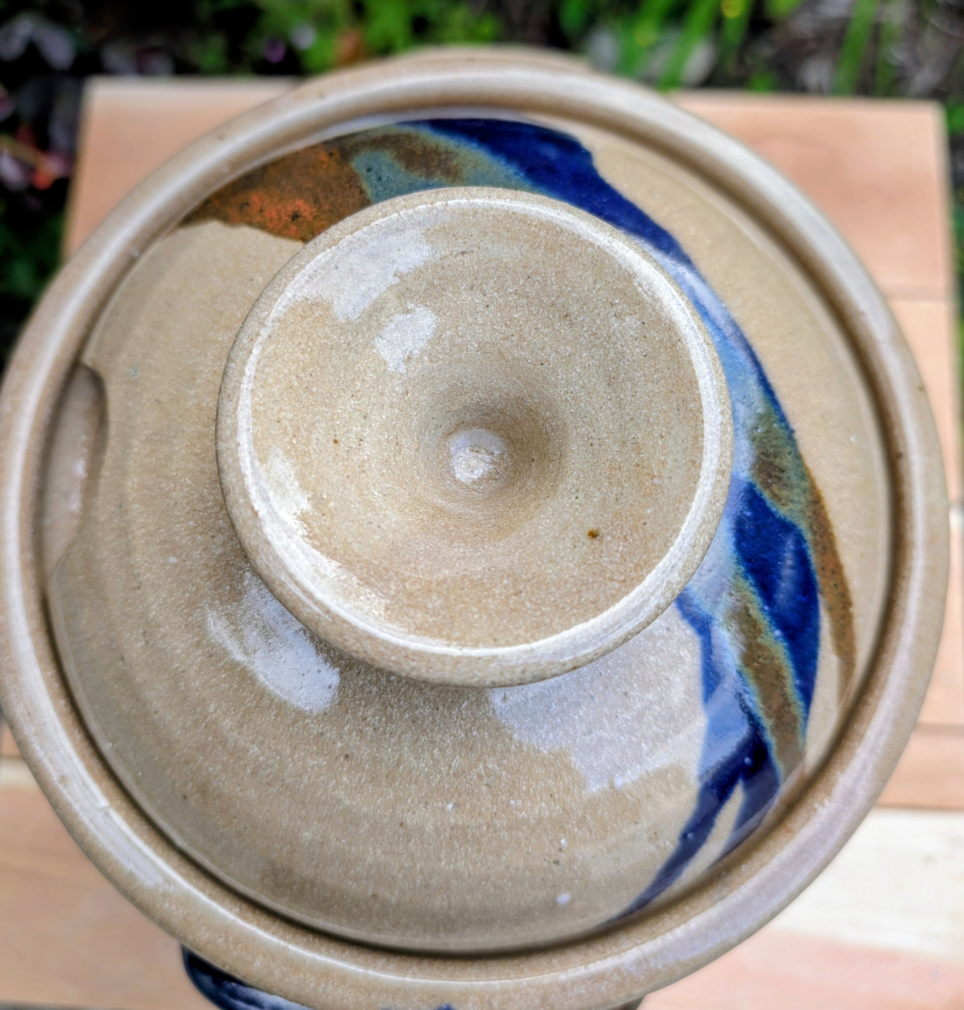 A beautifully handcrafted studio pottery tureen featuring a fitted lid, integrated handles, and a flowing cobalt blue glaze over warm oatmeal stoneware. Both functional and decorative, this artisan serving piece brings timeless craftsmanship and organic beauty to the table