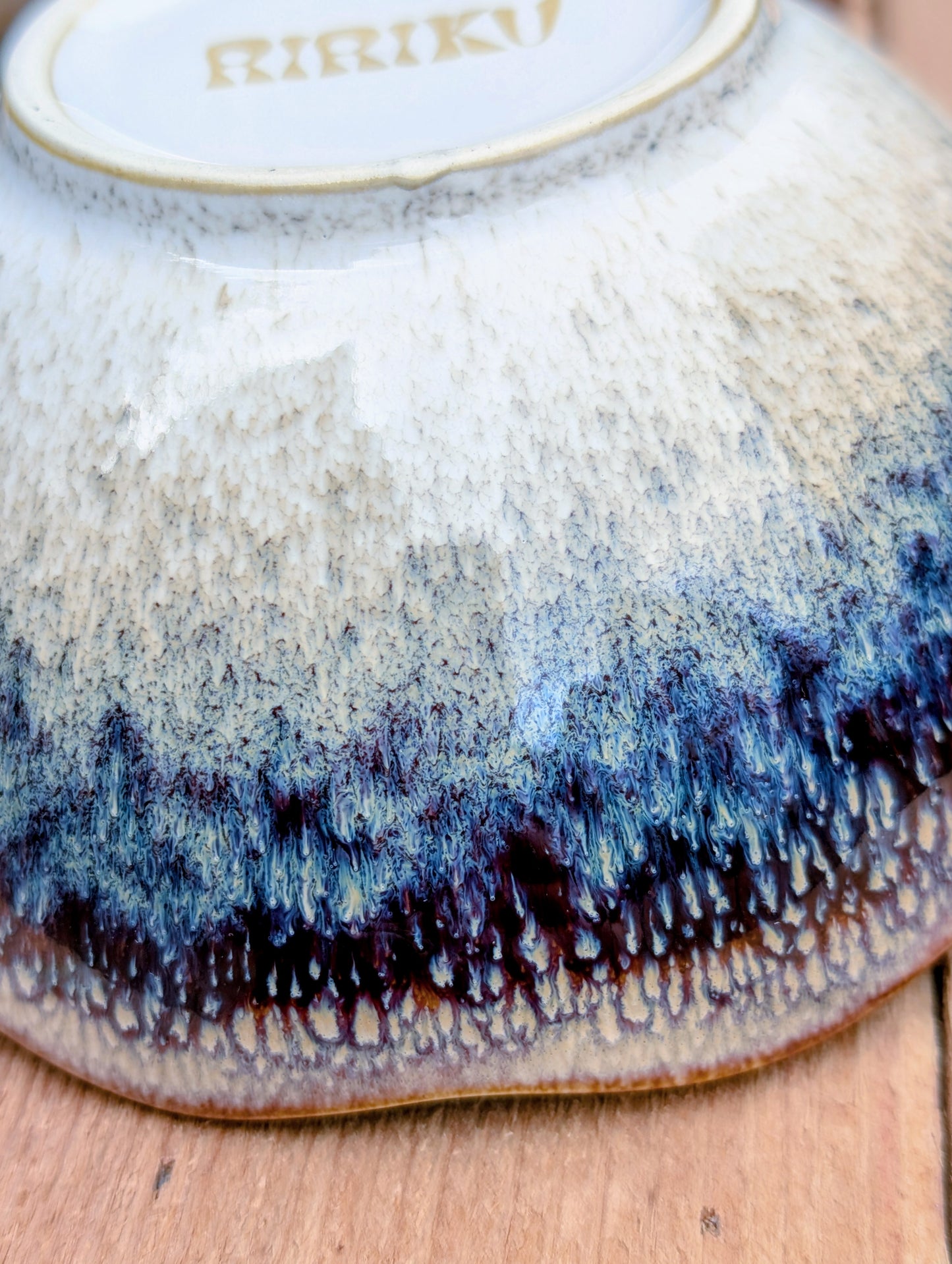 Bring understated elegance to everyday dining with this set of three RIRAKU stackable stoneware bowls. Featuring organically scalloped rims and beautifully layered reactive glazes inspired by traditional Japanese pottery, these versatile bowls are perfect for soups, rice, snacks, desserts, and small shared dishes.