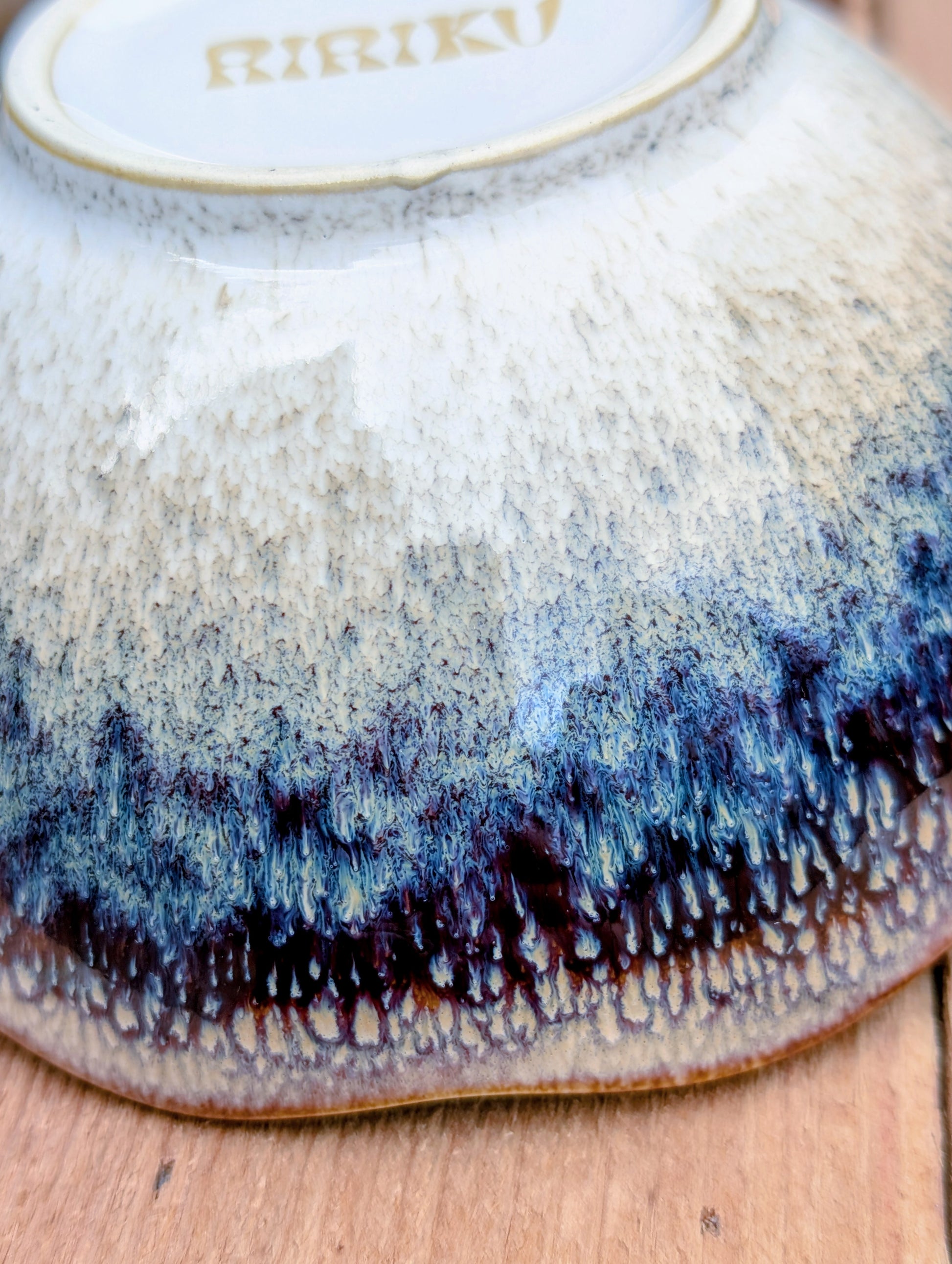 Bring understated elegance to everyday dining with this set of three RIRAKU stackable stoneware bowls. Featuring organically scalloped rims and beautifully layered reactive glazes inspired by traditional Japanese pottery, these versatile bowls are perfect for soups, rice, snacks, desserts, and small shared dishes.