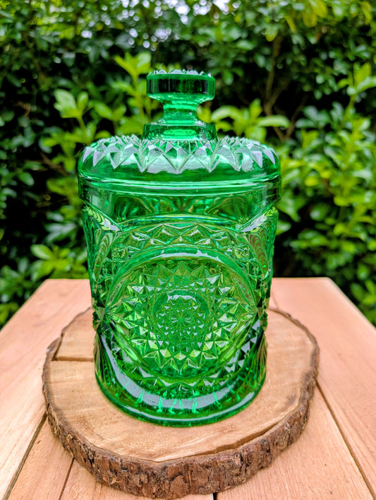 A brilliant Mid-Century collectible crafted in rich emerald pressed glass featuring Imperial's iconic Hobstar pattern.