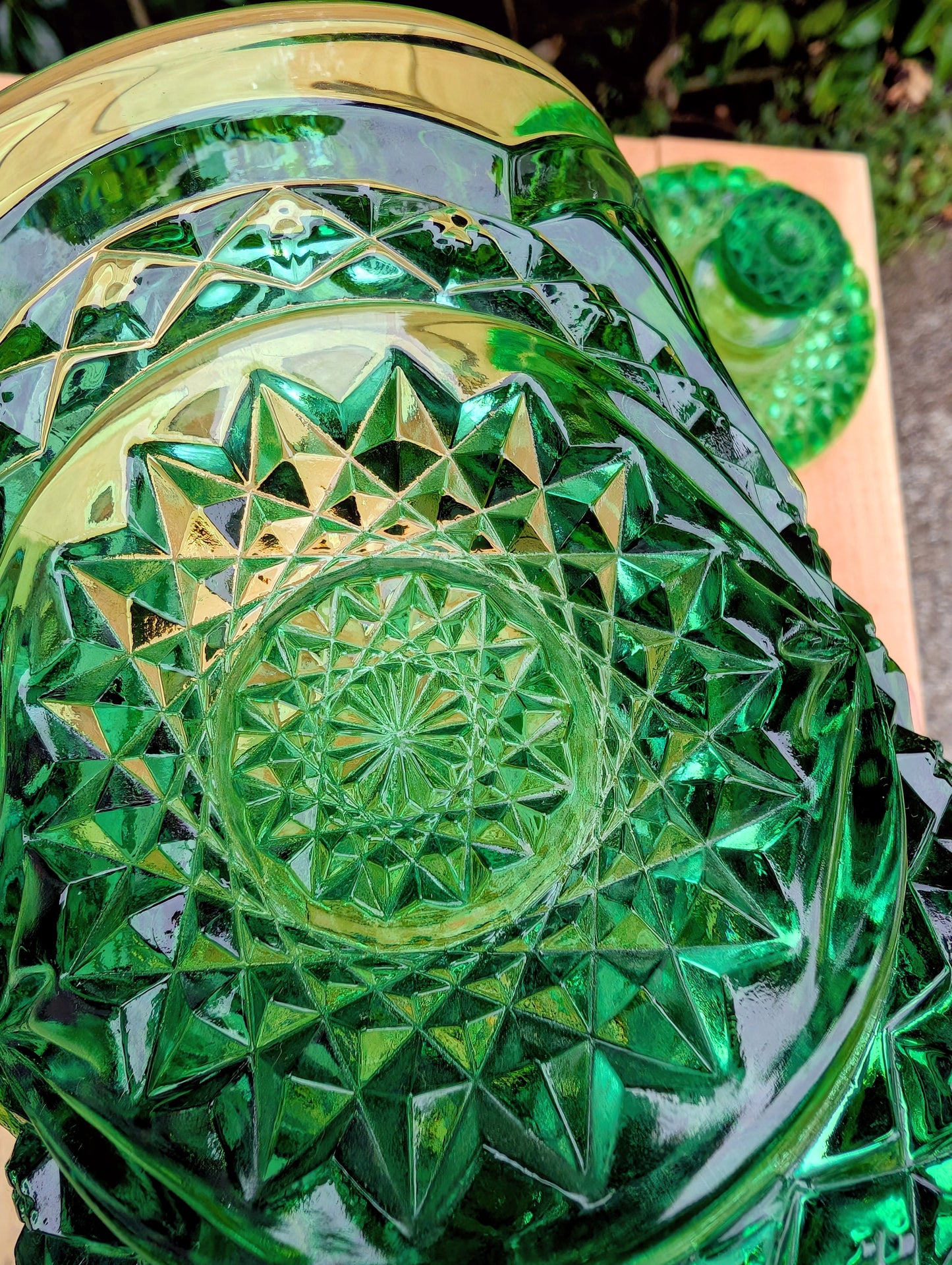 A brilliant Mid-Century collectible crafted in rich emerald pressed glass featuring Imperial's iconic Hobstar pattern.