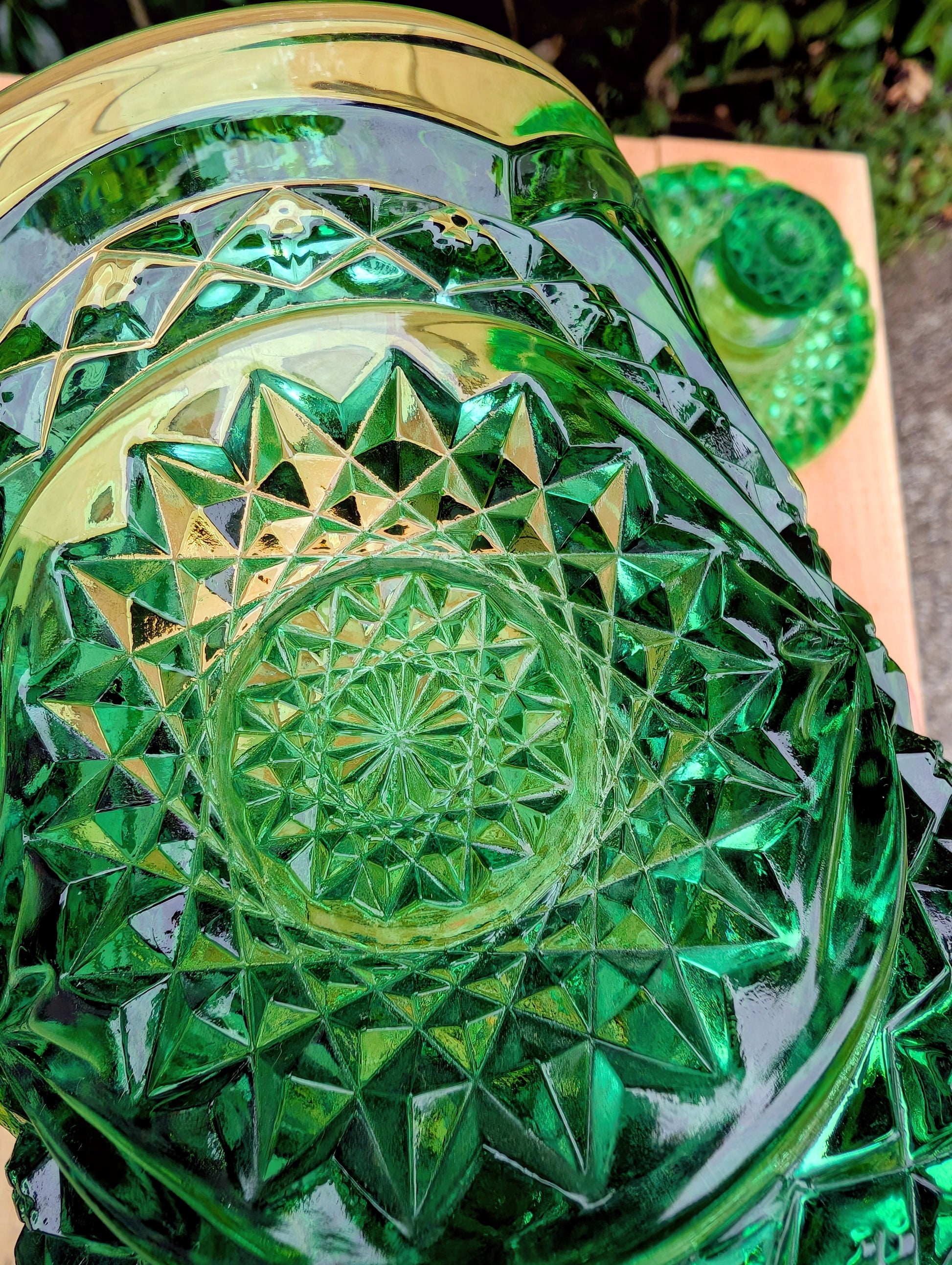 A brilliant Mid-Century collectible crafted in rich emerald pressed glass featuring Imperial's iconic Hobstar pattern.