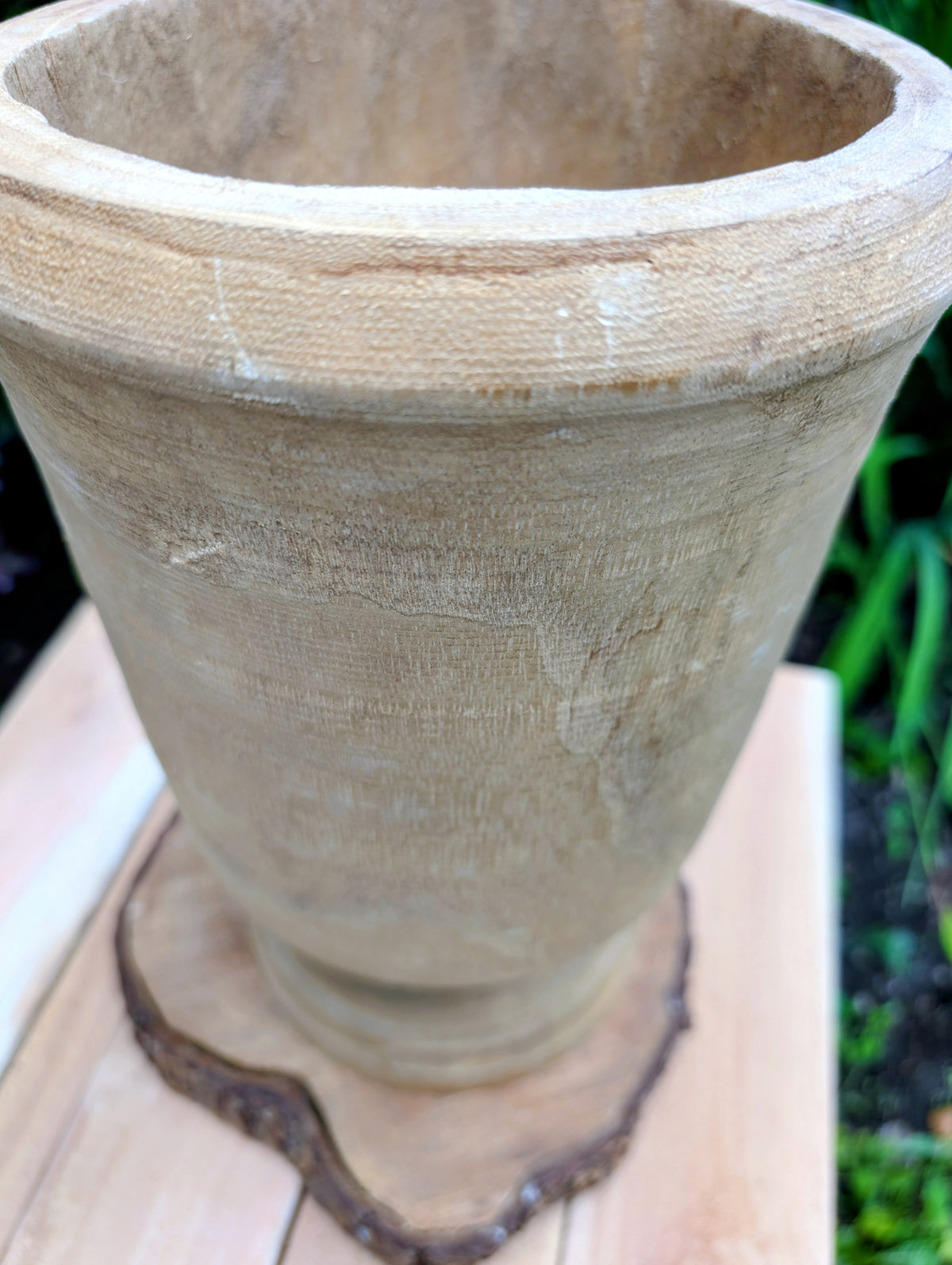 Bring natural warmth and organic texture into your home with this hand-carved paulownia wood footed vase. Its sculptural silhouette and unfinished wood grain make it a timeless accent for dried botanicals, seasonal branches, or as a beautiful standalone decorative piece.