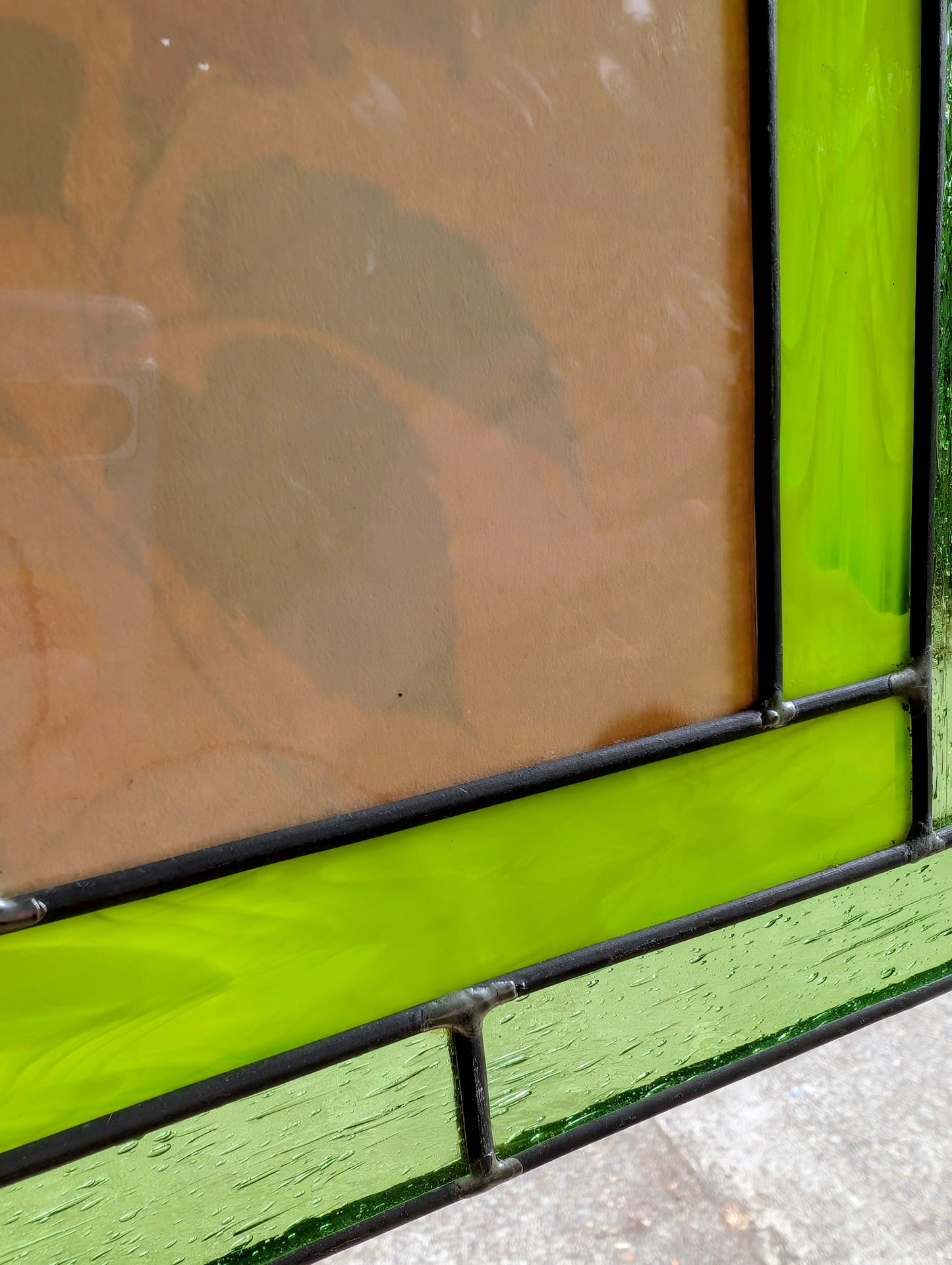 Bring the beauty of a hummingbird in bloom into your home with this handcrafted stained glass hanging panel. Featuring vibrant textured art glass surrounding a detailed hummingbird and hibiscus centerpiece, it catches natural light beautifully and adds year-round color to any window, sunroom, or garden-inspired space.